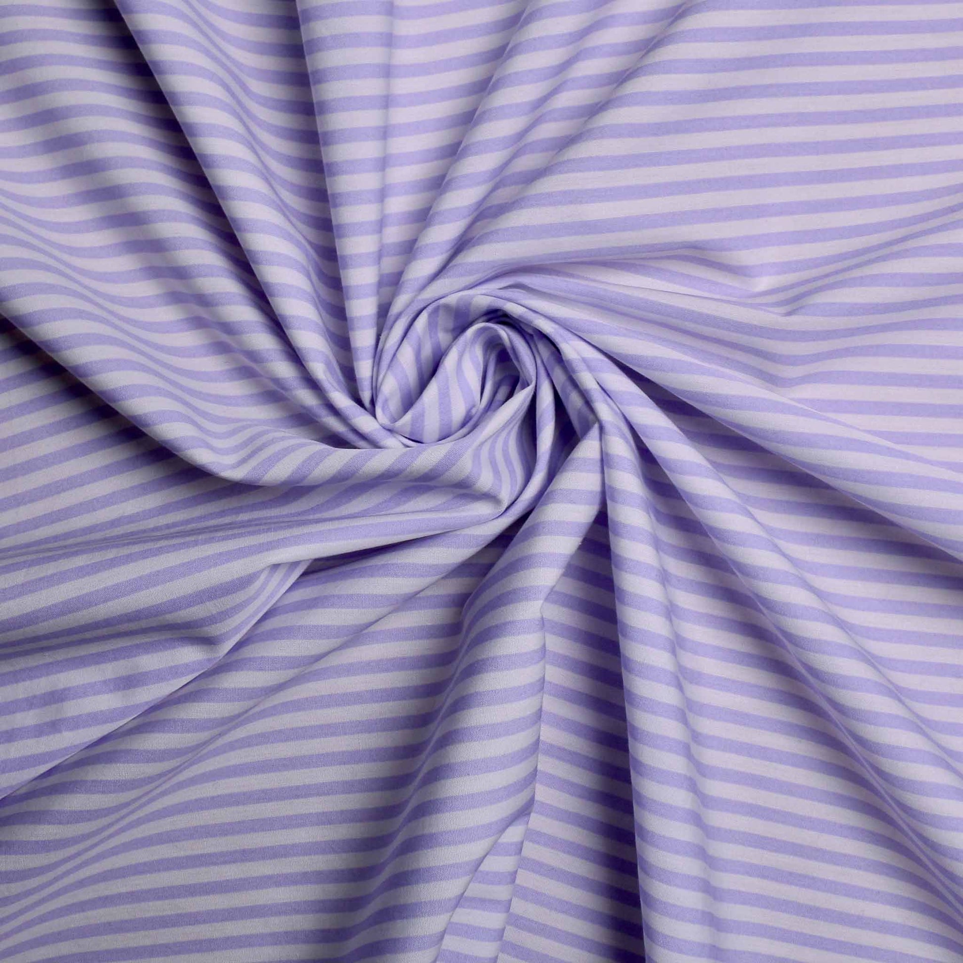 lilac cotton poplin dressmaking fabric with a striped design