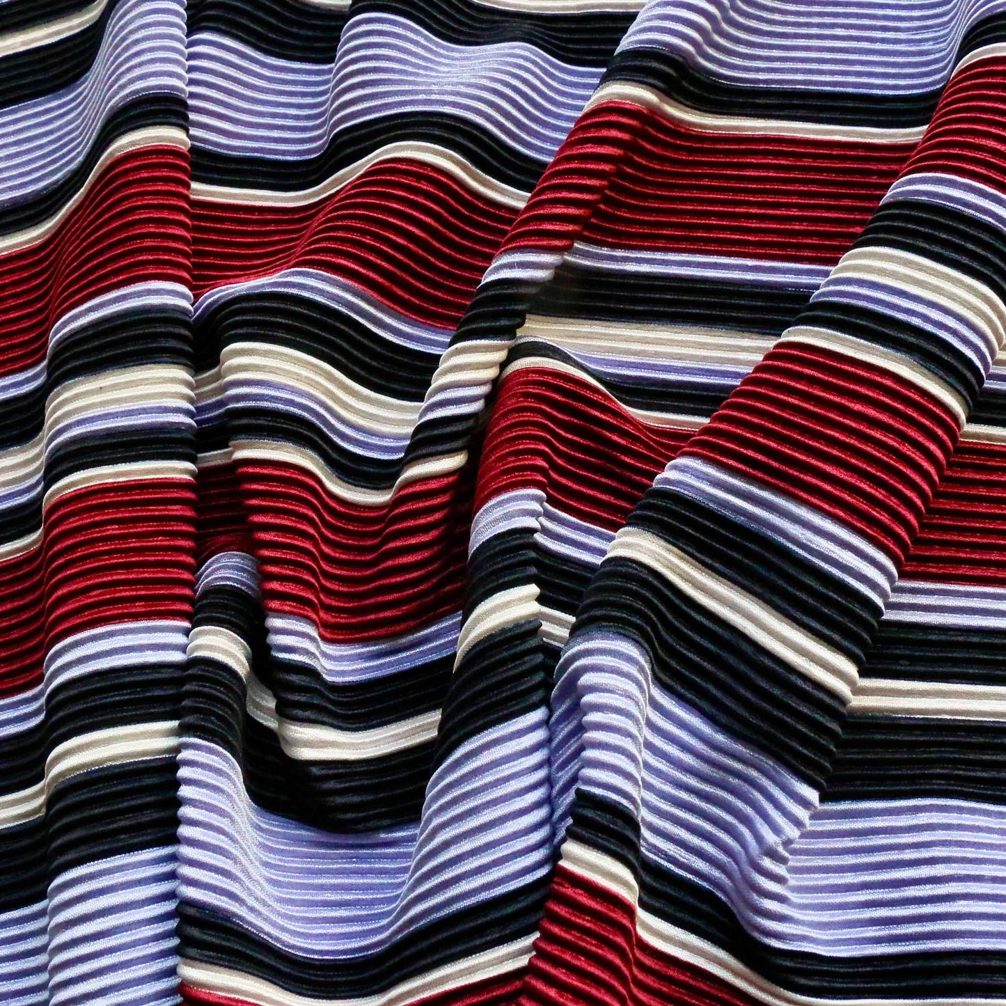 striped pleated plisse dressmaking fabric with maroon blue and lilac stripe pattern