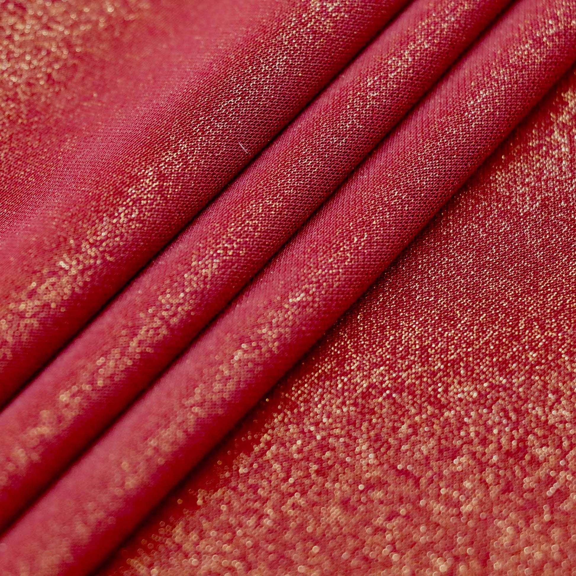 maroon and gold lycra dressmaking fabric with a shimmer effect texture