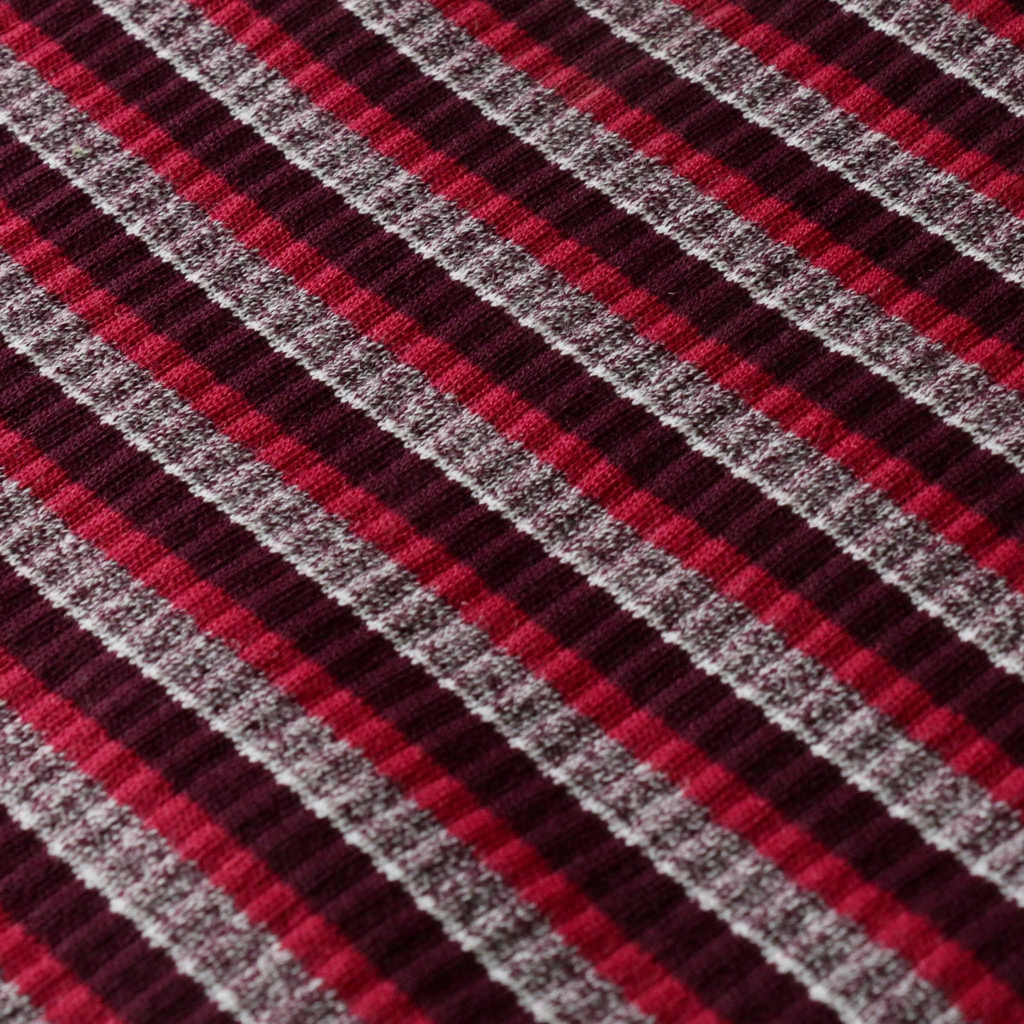 stripey rib jersey knit dressmaking fabric with pink grey and marron striped design