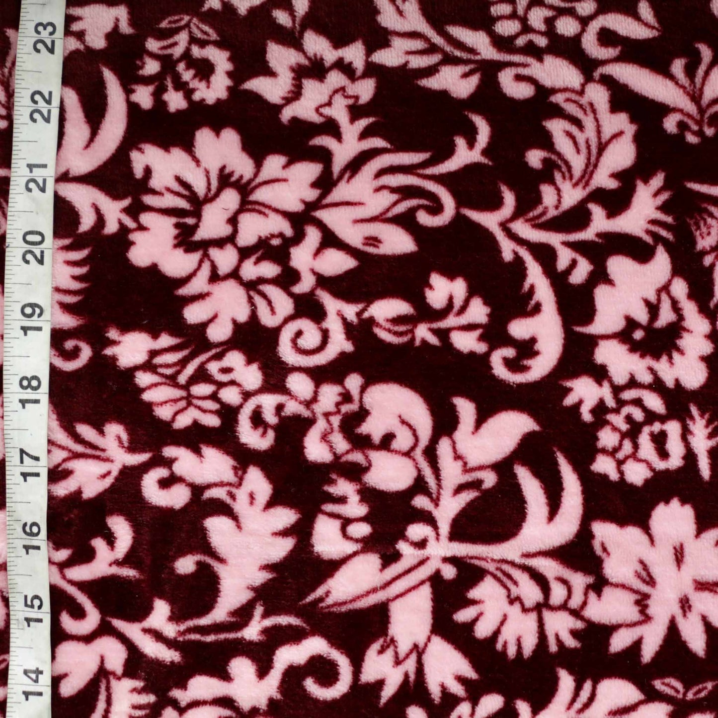 fleece dressmaking fabric with classical floral print in maroon colour