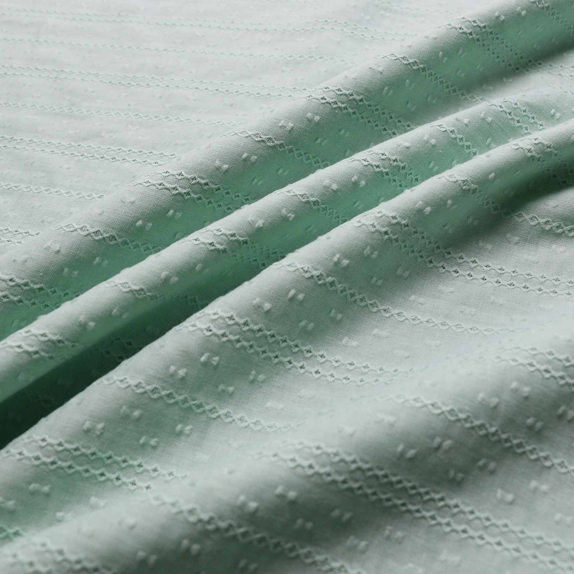 broad anglaise cotton voile dressmaking fabric in mint green colour