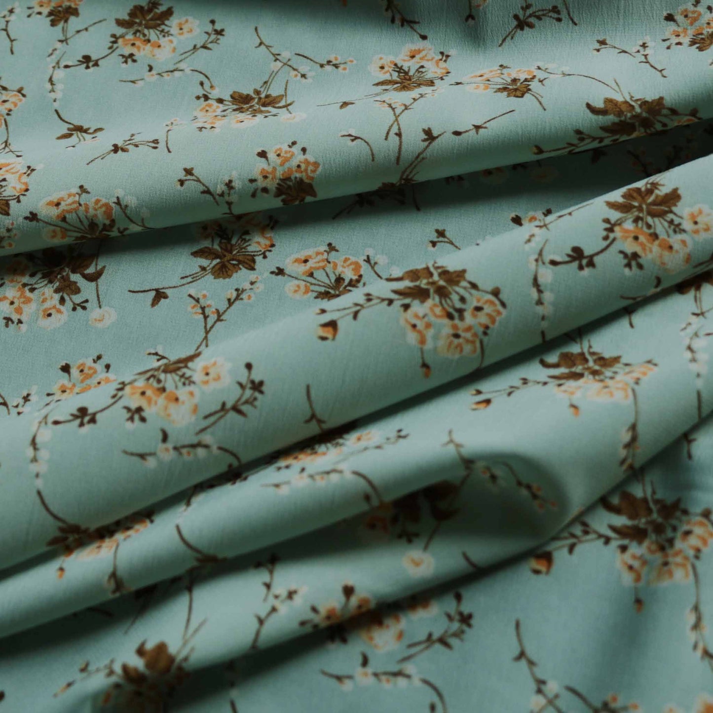 floral duck egg mint chiffon polyester dressmaking fabric with beige and brown printed floral pattern