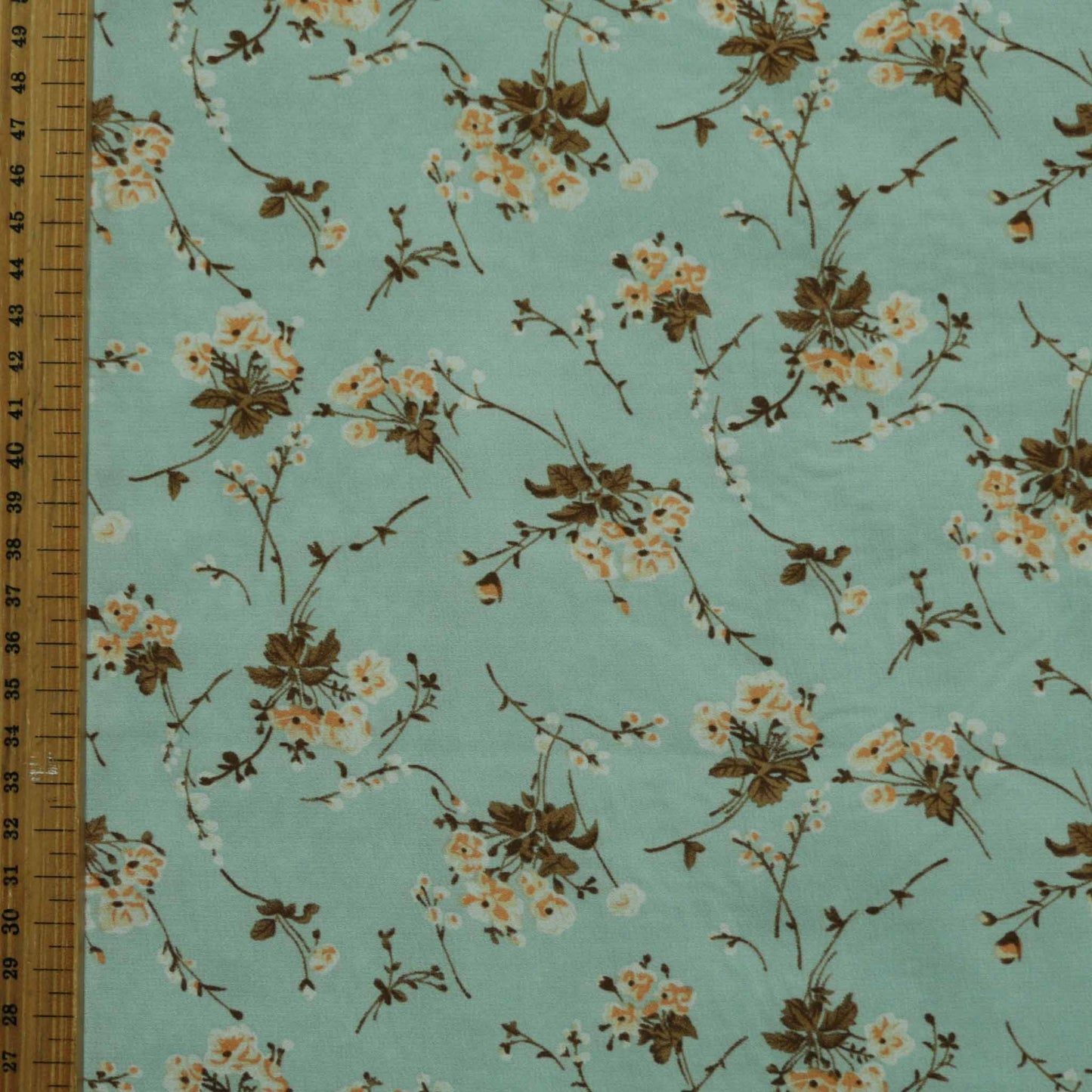 metre mint chiffon polyester synthetic dressmaking fabric with beige and brown printed flowers