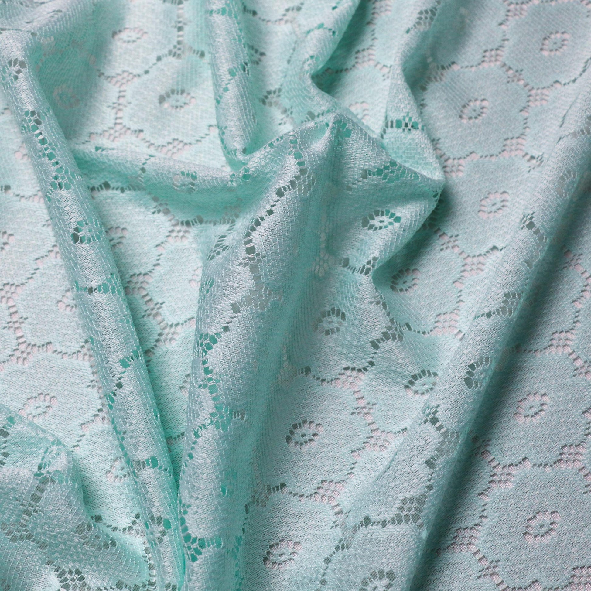 delicate dressmaking lace fabric with floral pattern mint green