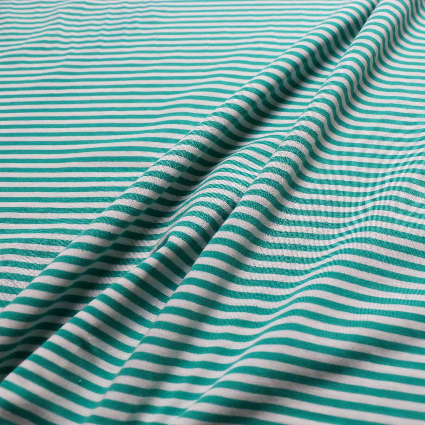 white and mint stripe jersey dressmaking fabric