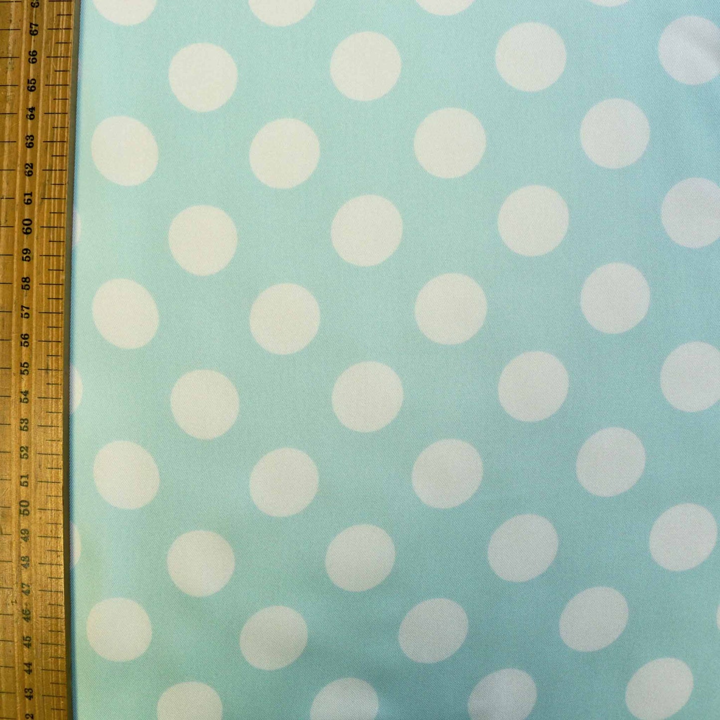 metre mint satin dressmaking twill fabric with white polka dots