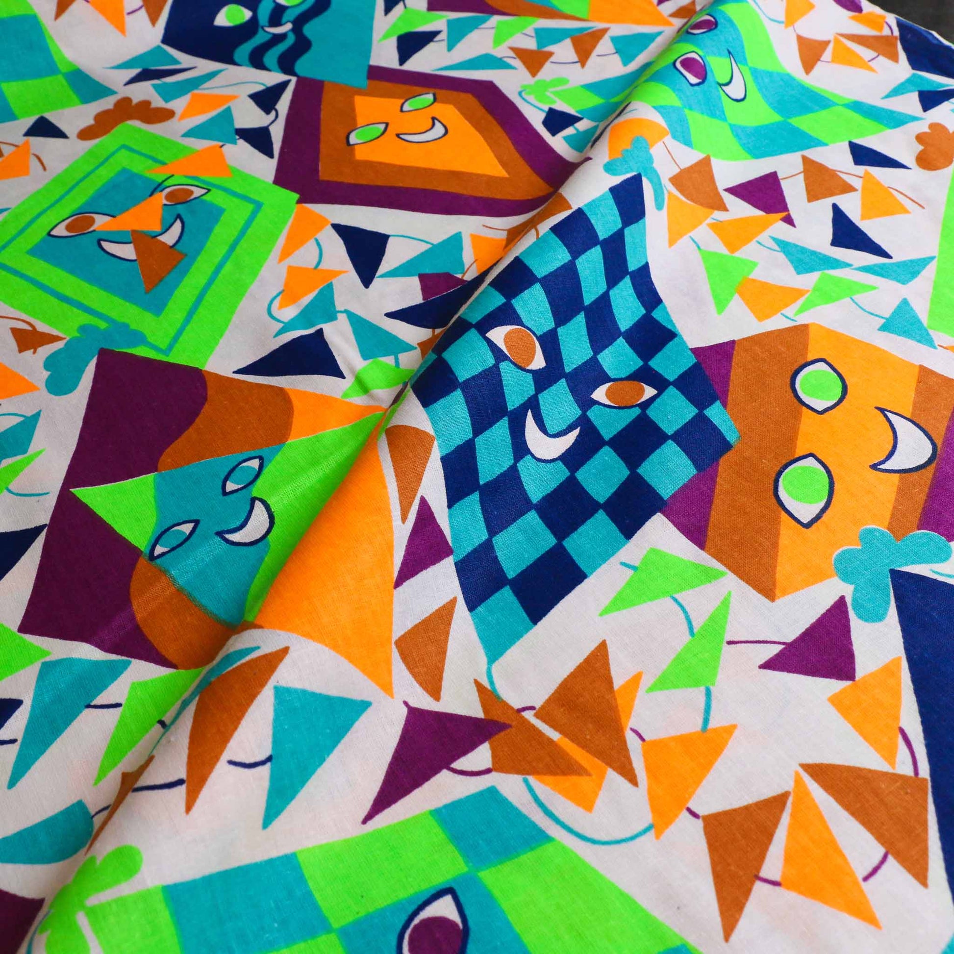 multicoloured sustainable retro cotton dressmaking poplin fabric with smiling kites print