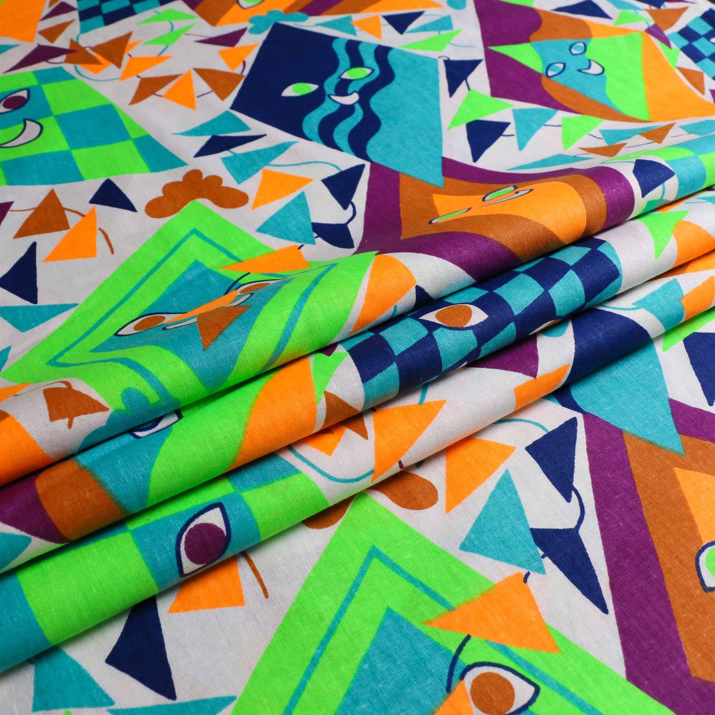 folded white retro cotton dressmaking sustainable deadstock fabric with multicoloured kites print