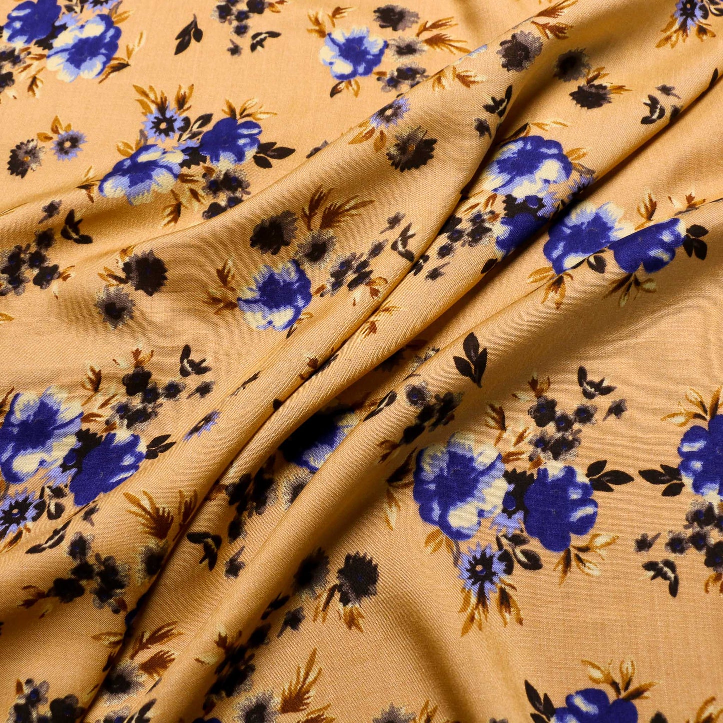 mustard coloured viscose challis dress fabric with blue floral print