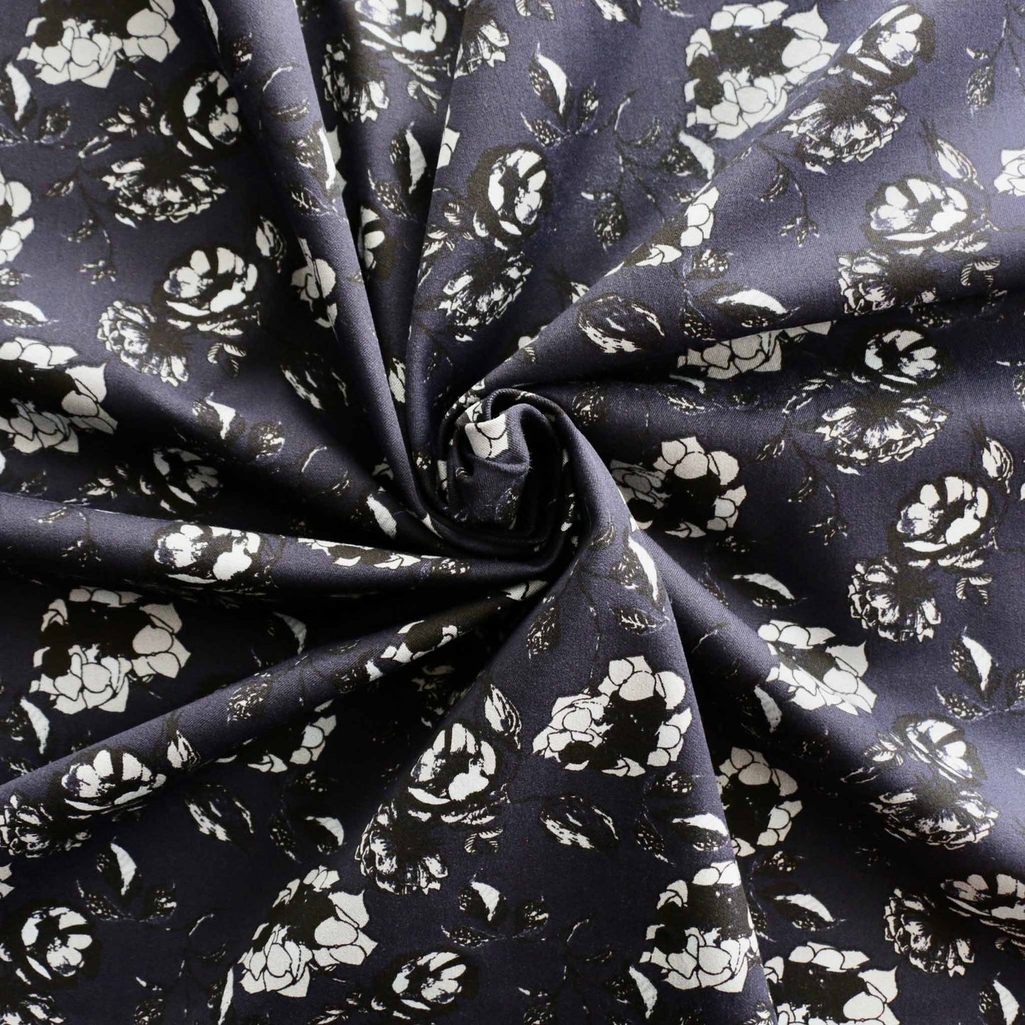 floral printed flowers in white and black on navy blue cotton sateen dressmaking fabric