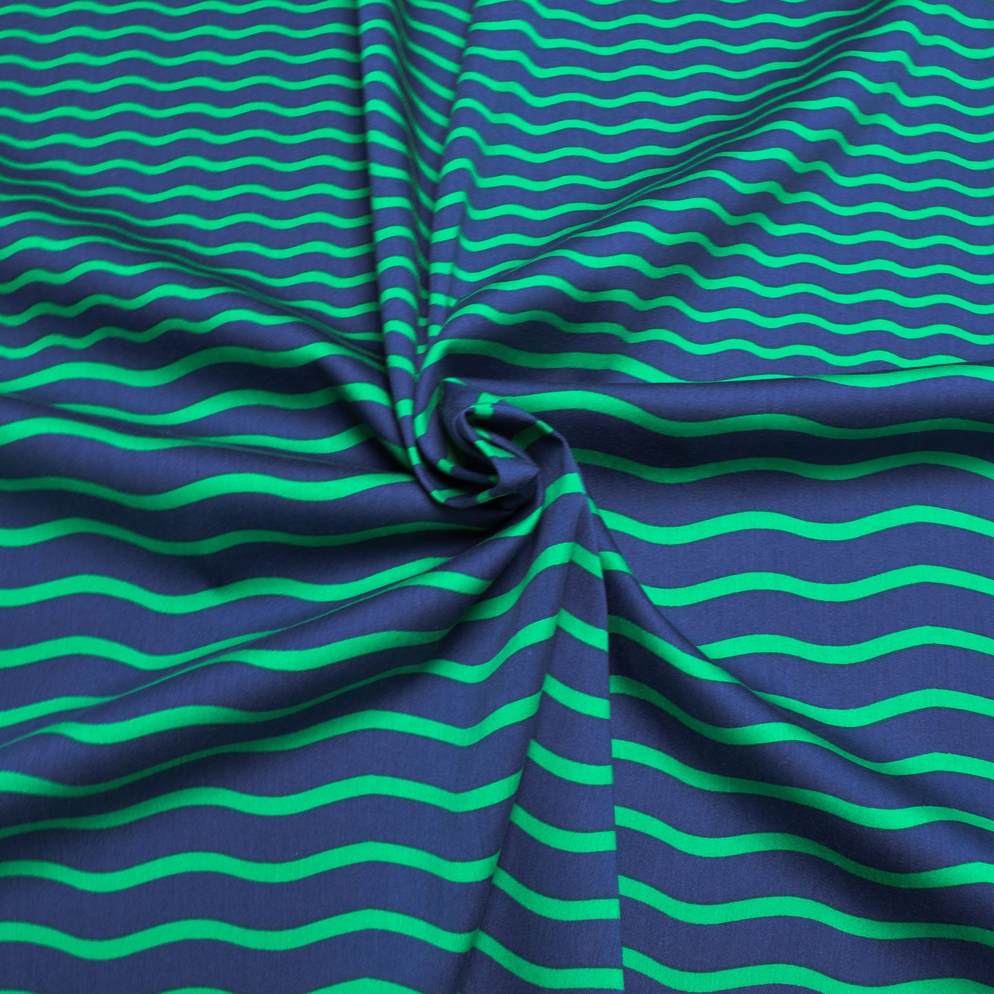 navy blue cotton sateen dressmaking fabric with green stripes