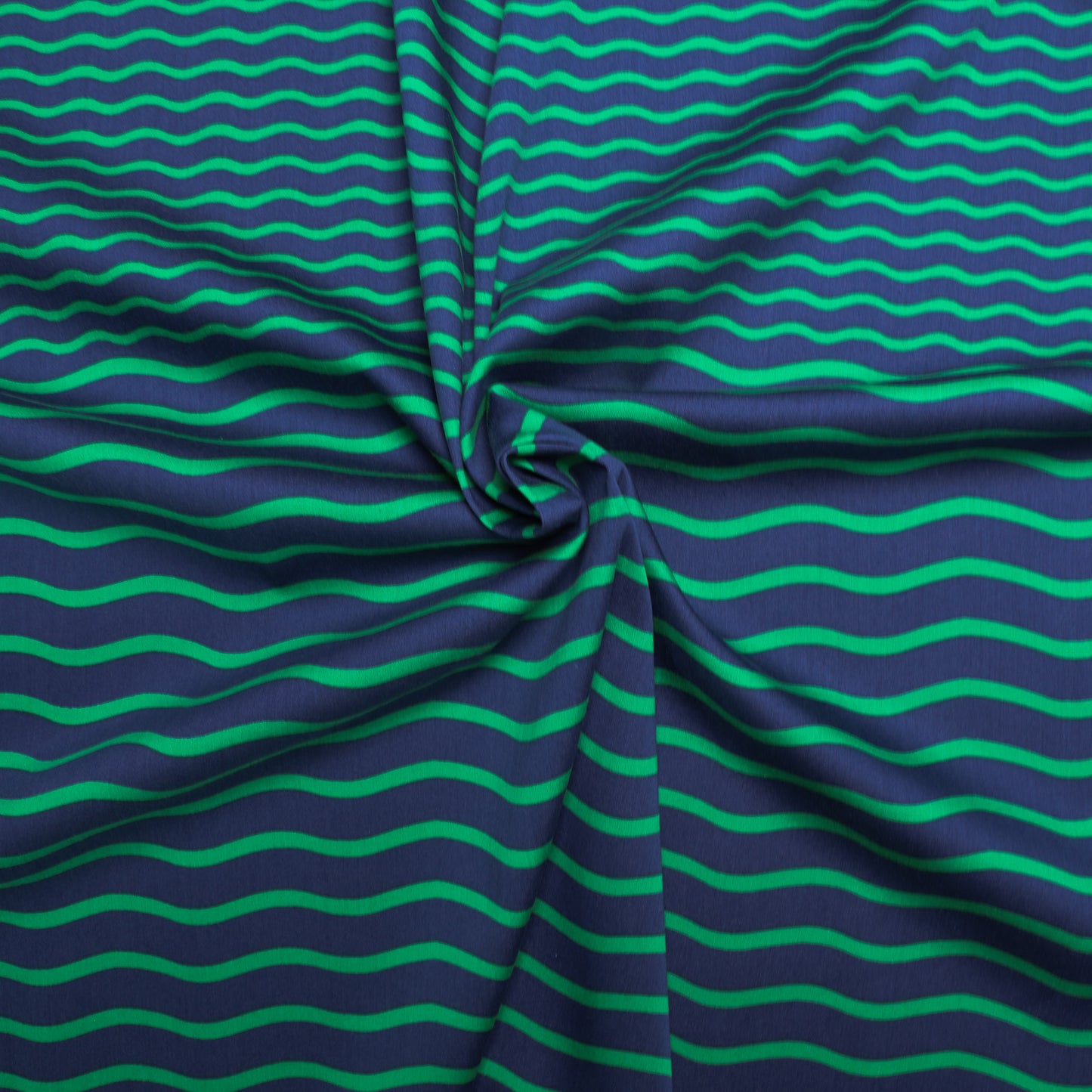 navy blue cotton sateen fabric with green wavy stripe pattern