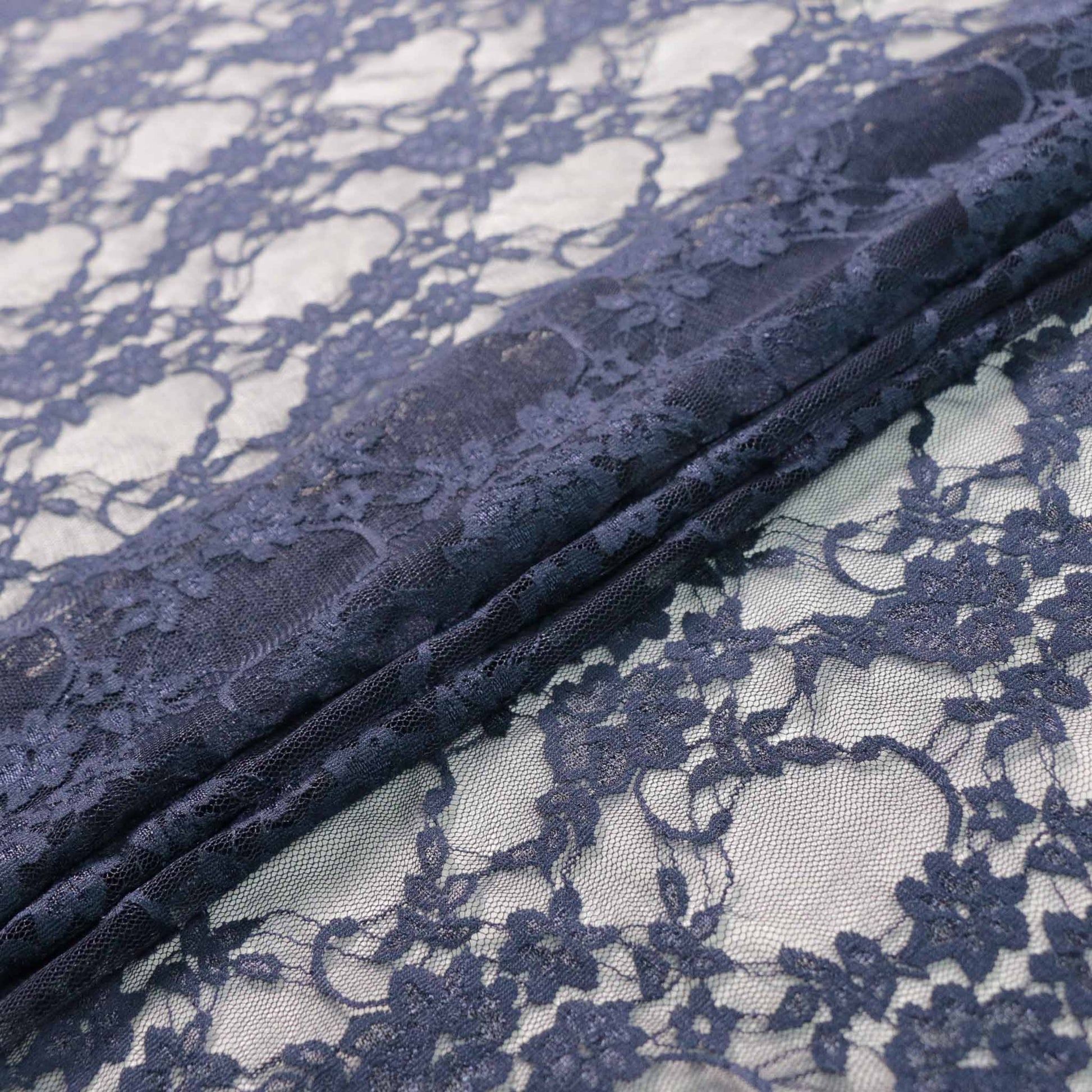 stretchy navy lace dressmaking fabric with floral design