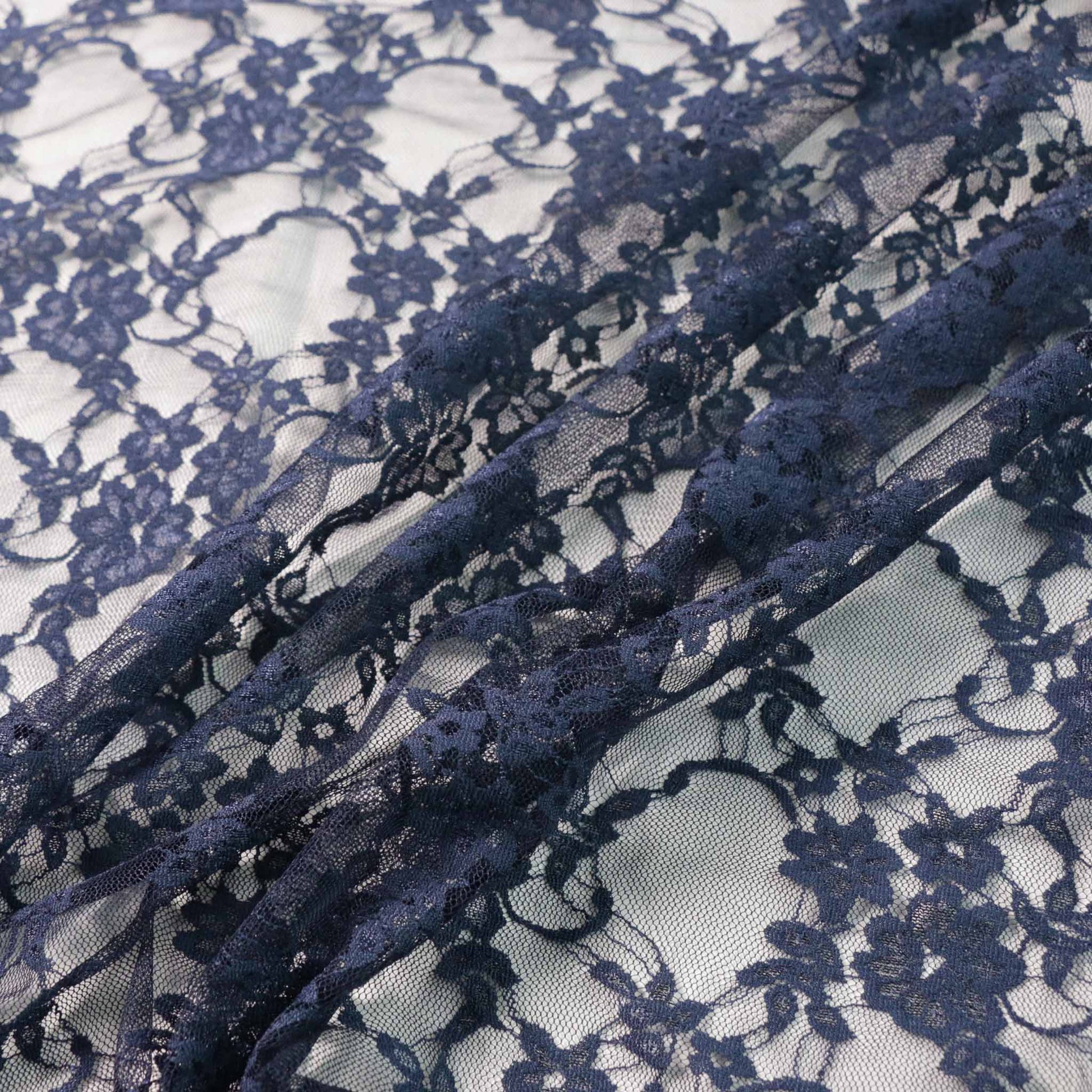 navy floral design stretchy lace dressmaking fabric