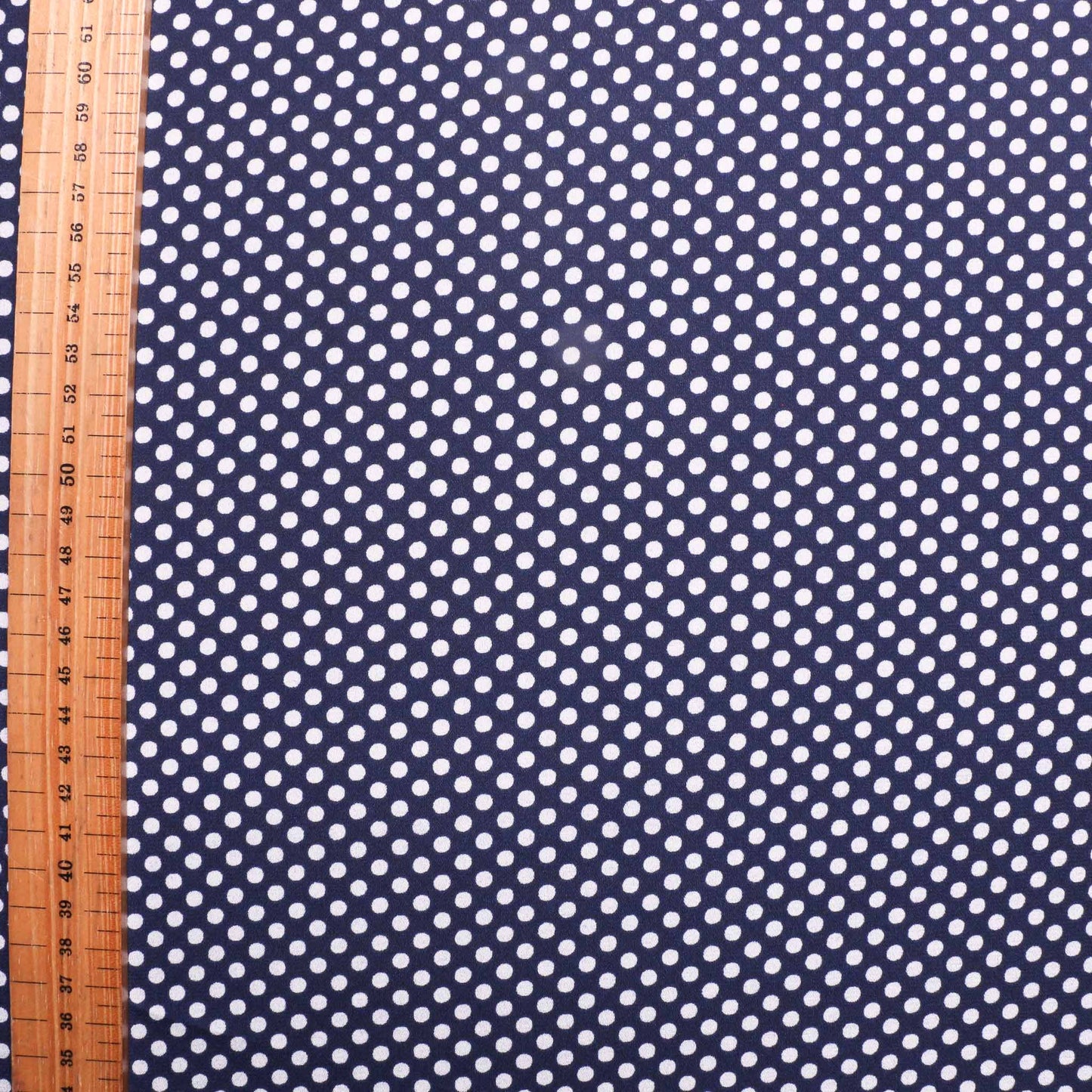 metre polka dot dressmaking fabric in navy and white uk