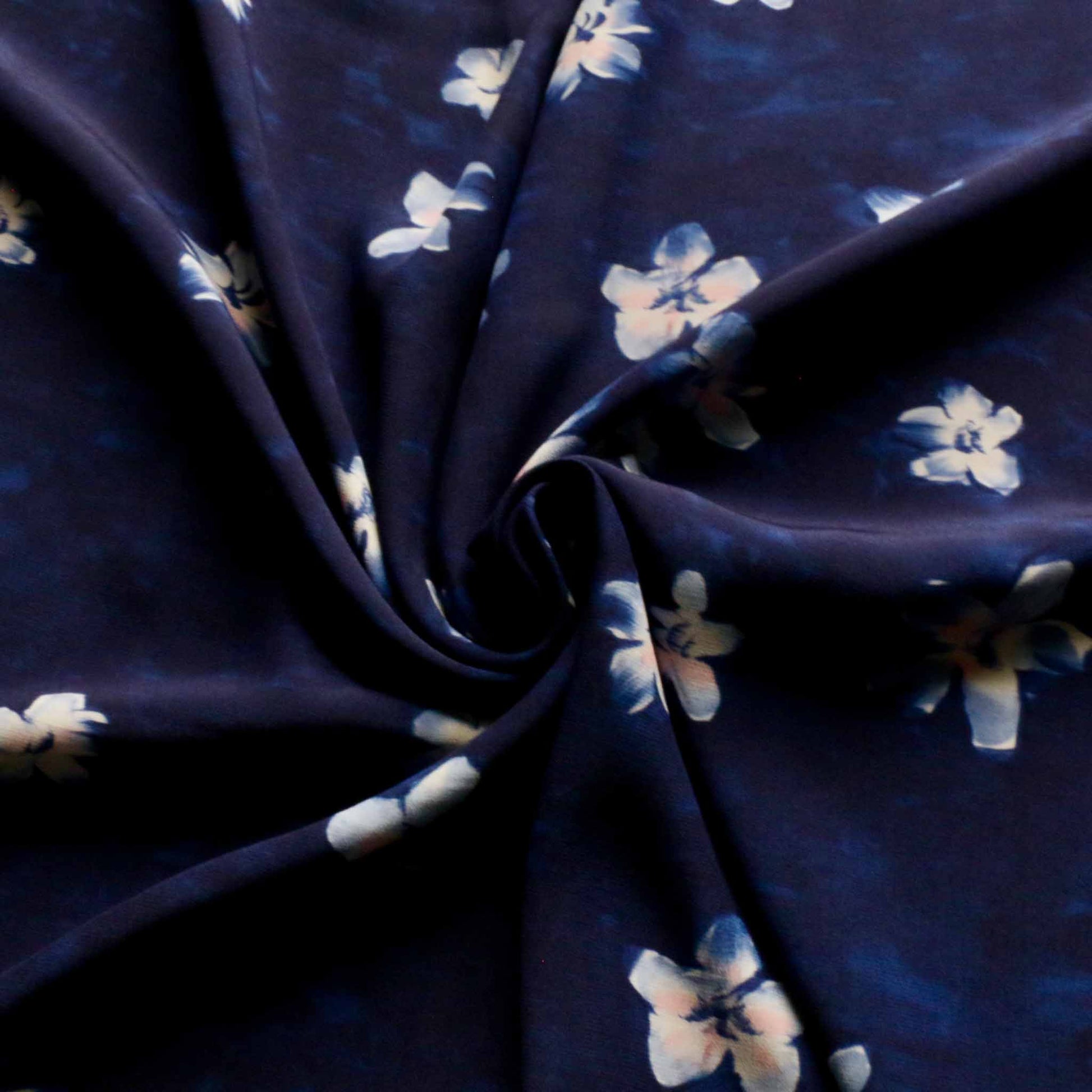 navy blue crepe back satin dressmaking fabric with white floral print