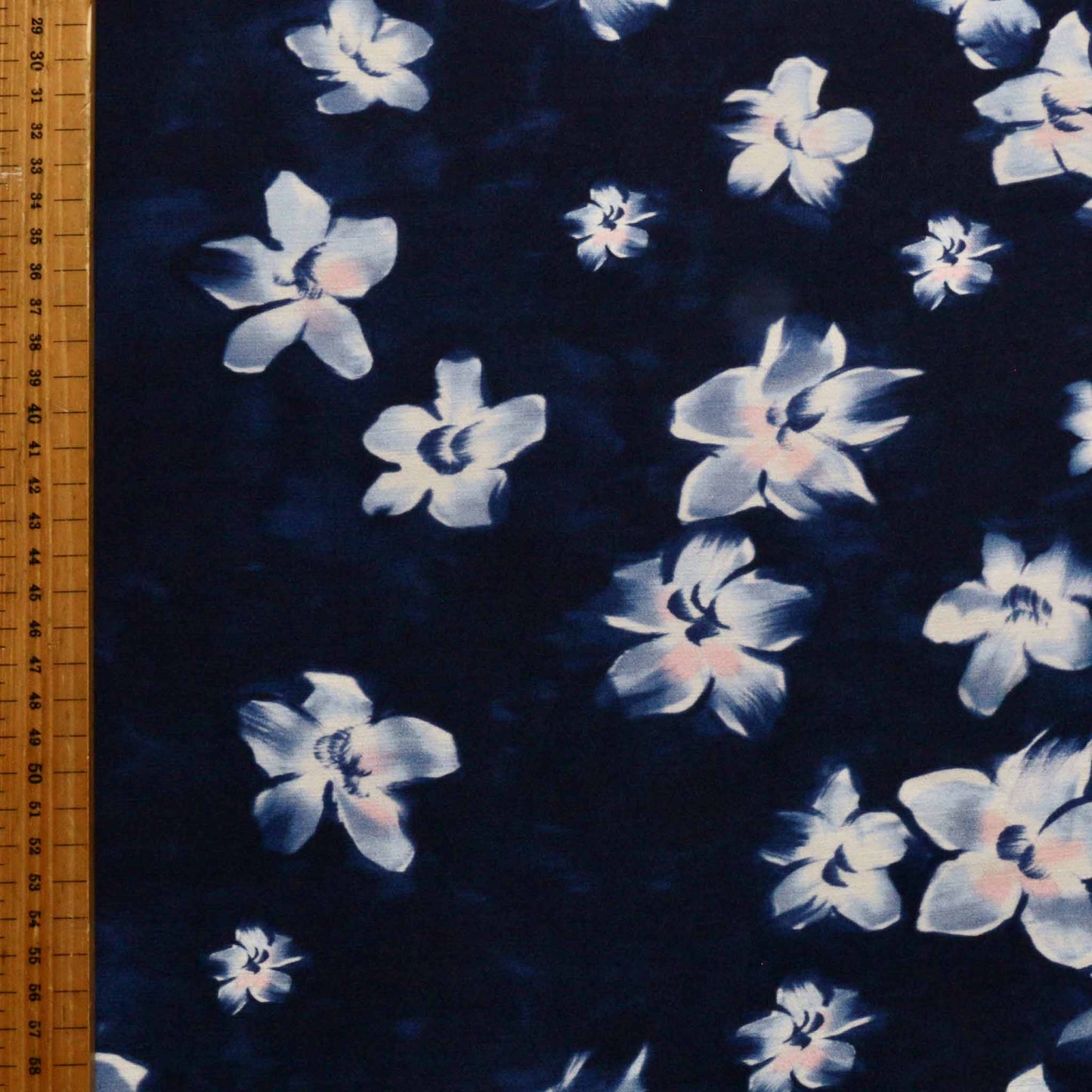 metre navy blue crepe back satin dressmaking fabric with white flora print