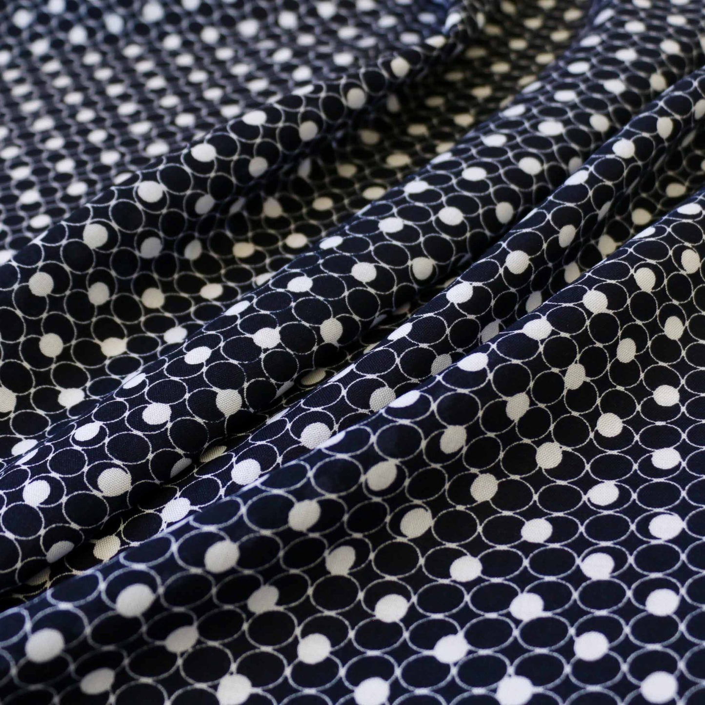 navy blue and white circles printed on viscose challis dressmaking rayon fabric