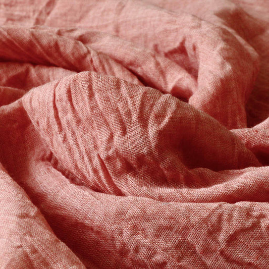 pastel peach polycotton lawn dressmaking fabric