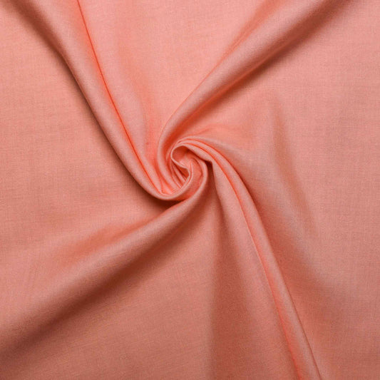 plain peach viscose challis dressmaking fabric