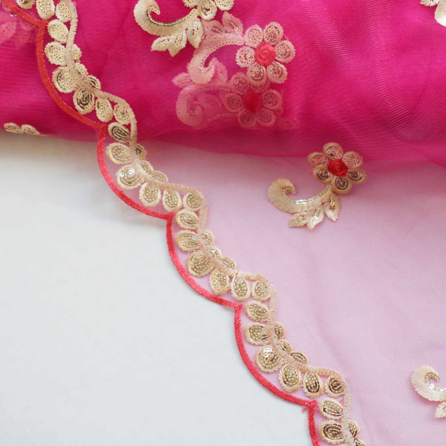 pink and gold embroidered Indian lace dressmaking fabric