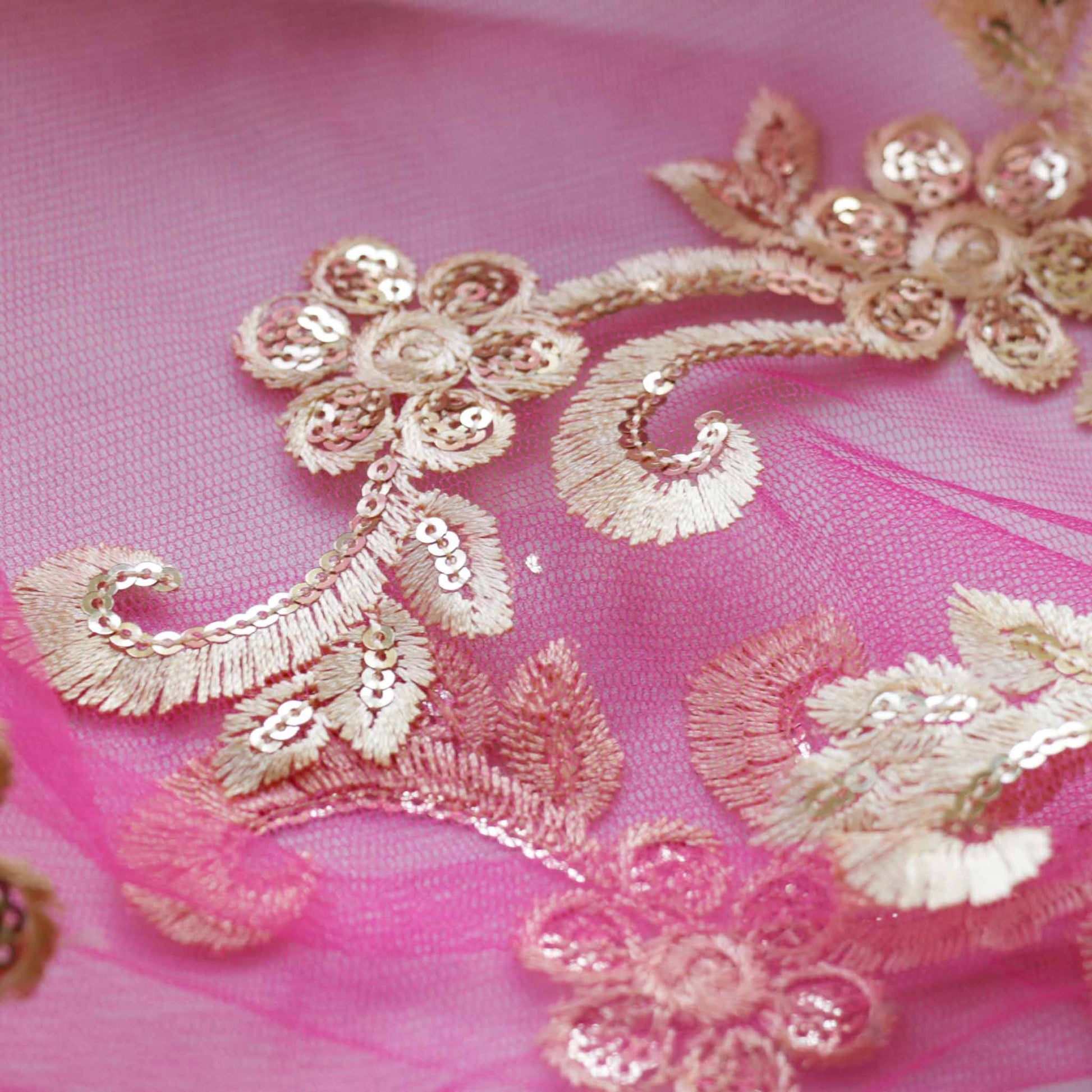 gold embroidery on pink Indian inspired dressmaking lace fabric