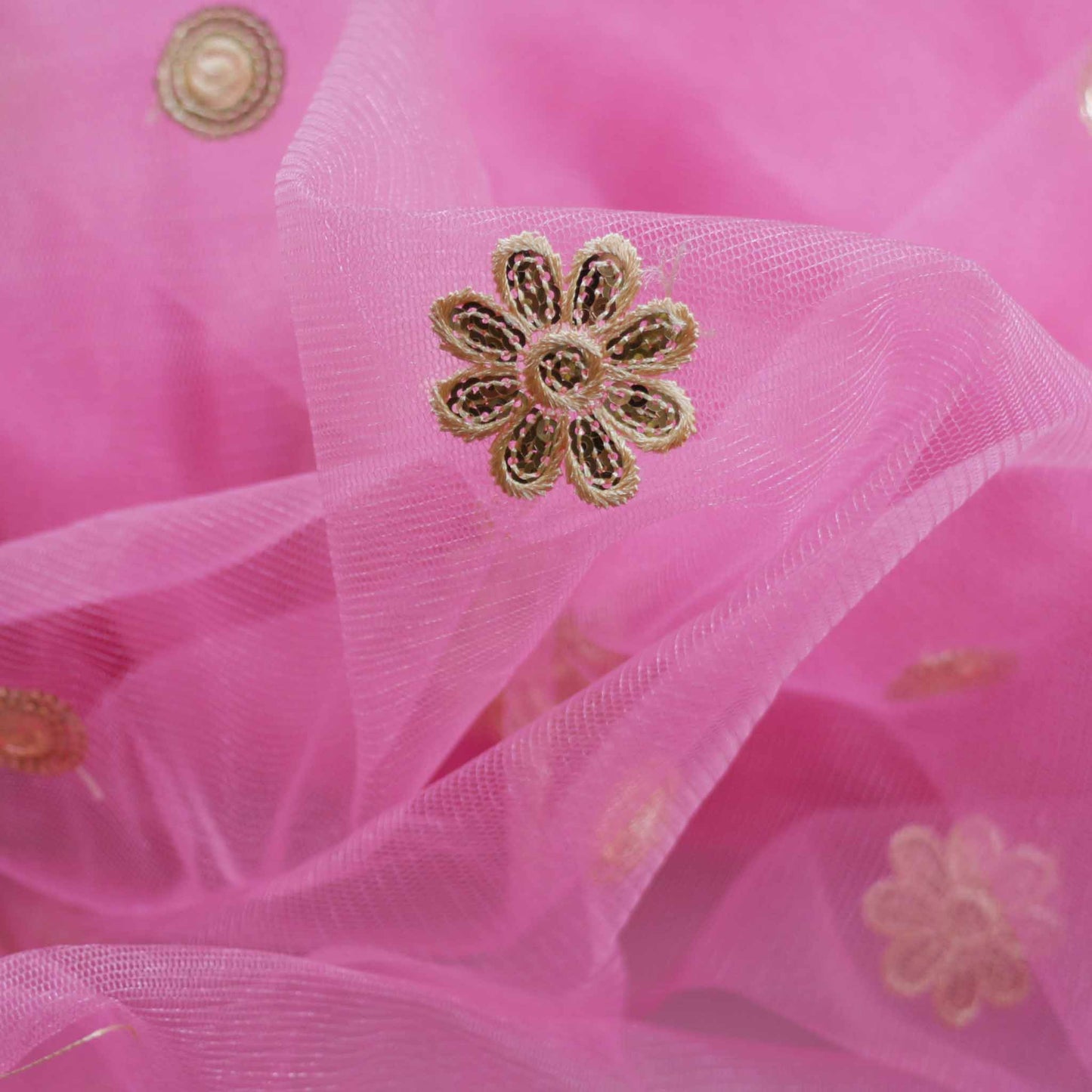gold embroidered flower on pink tulle Indian dressmaking fabric