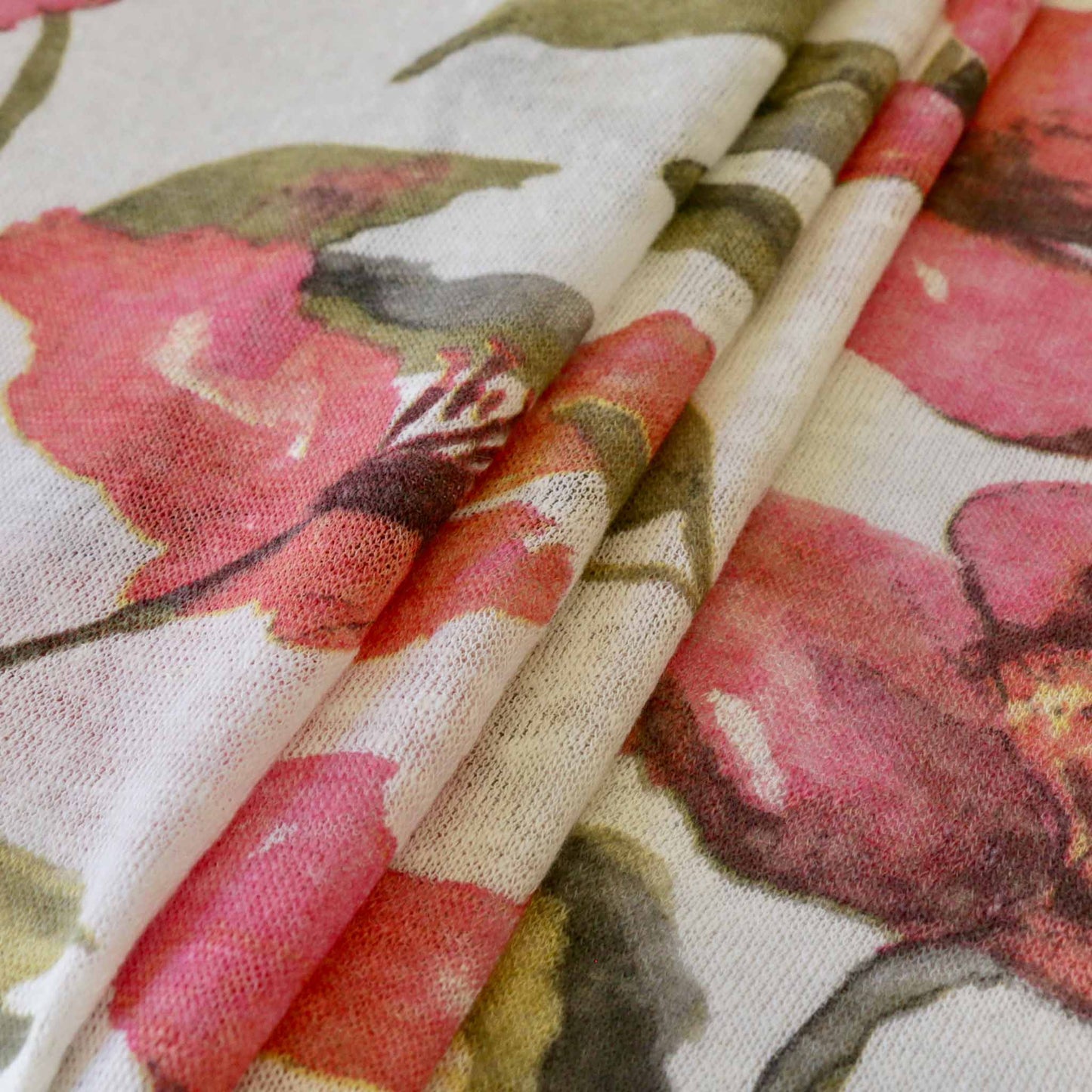 pink flower print on white linen jersey fabric for dressmaking