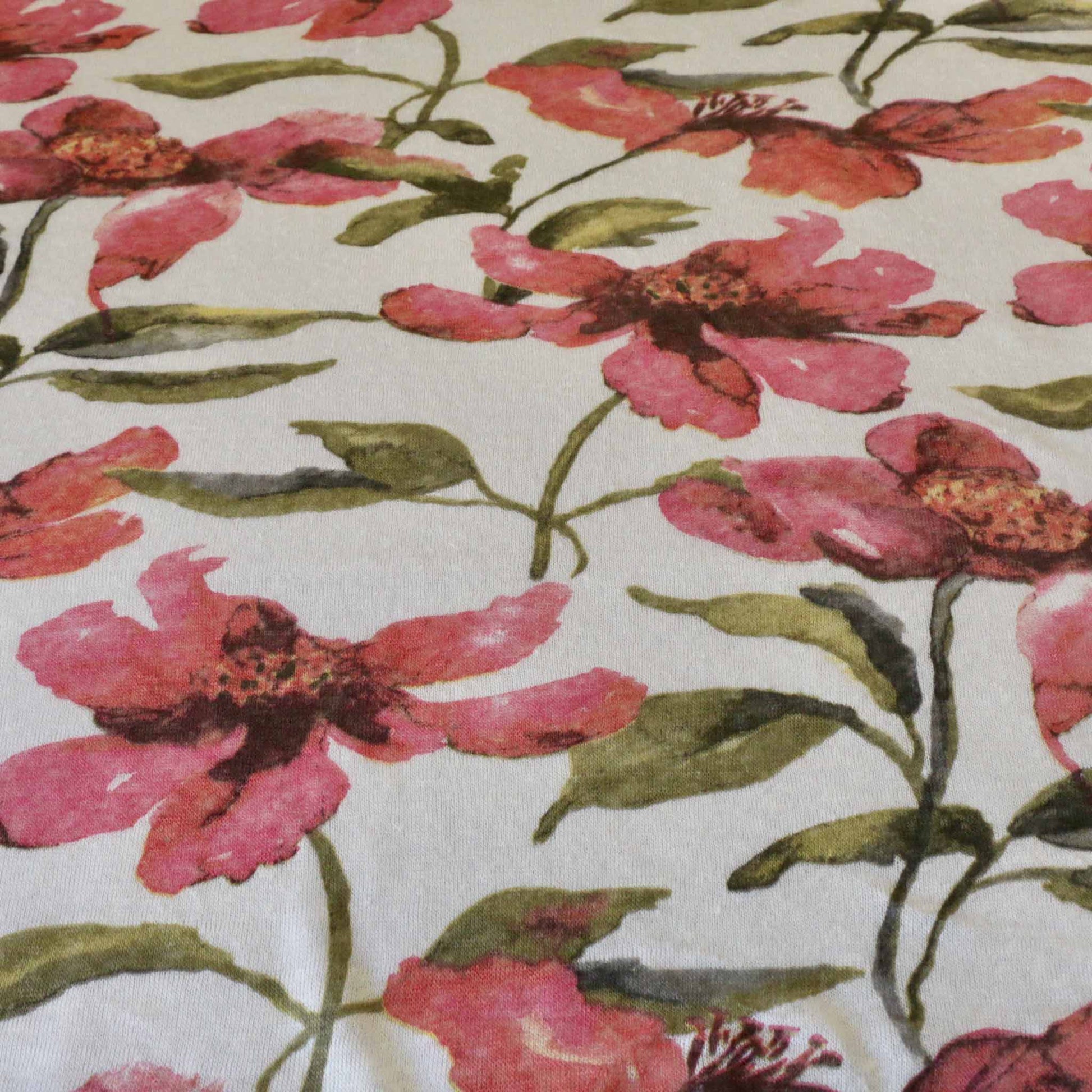 pink and white linen jersey dressmaking fabric with floral print