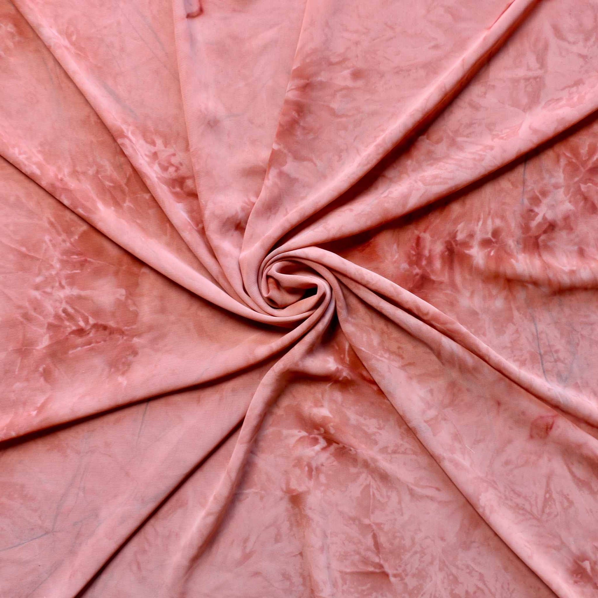 pink chiffon polyester dressmaking fabric with marbled effect