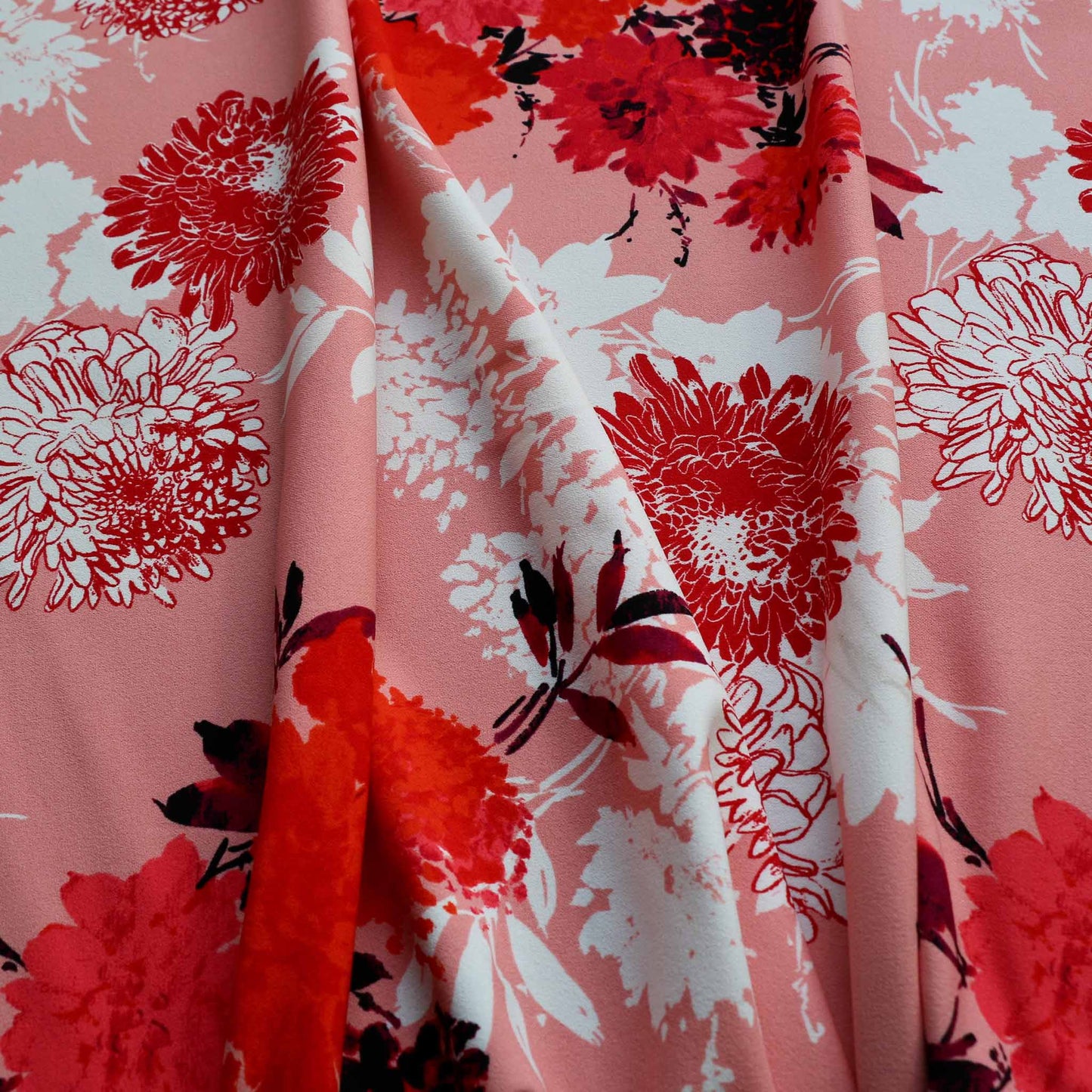 pink john kaldor dressmaking scuba fabric with red and white large floral print