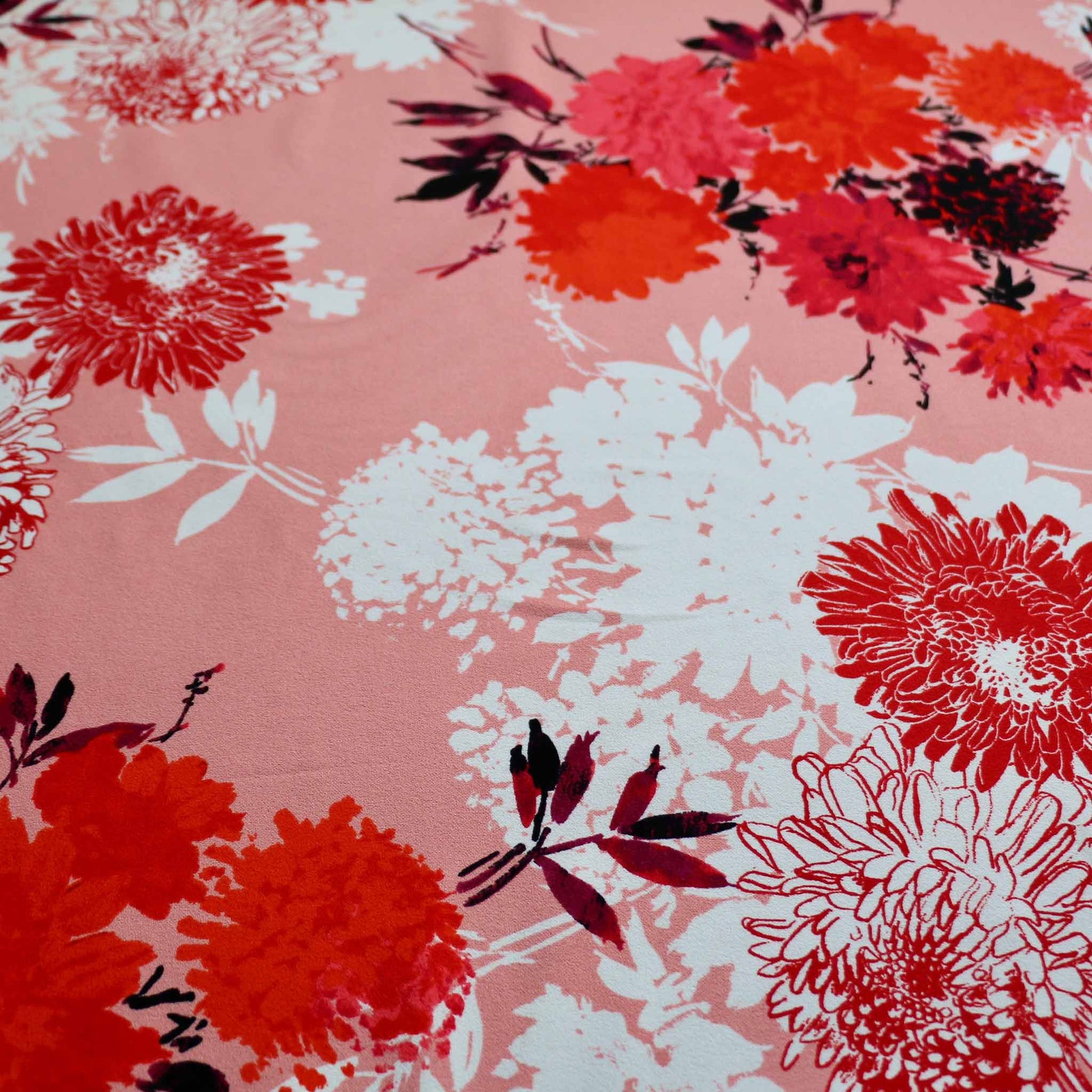 red and white flowers on pink deadstock scuba by john kaldor uk fabric designer