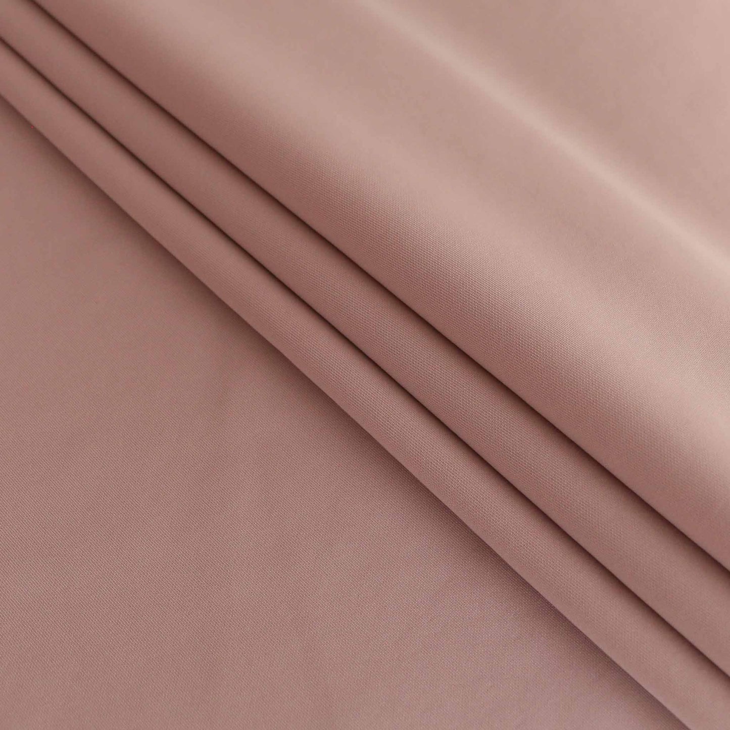 folded pink plain scuba fabric for dressmaking