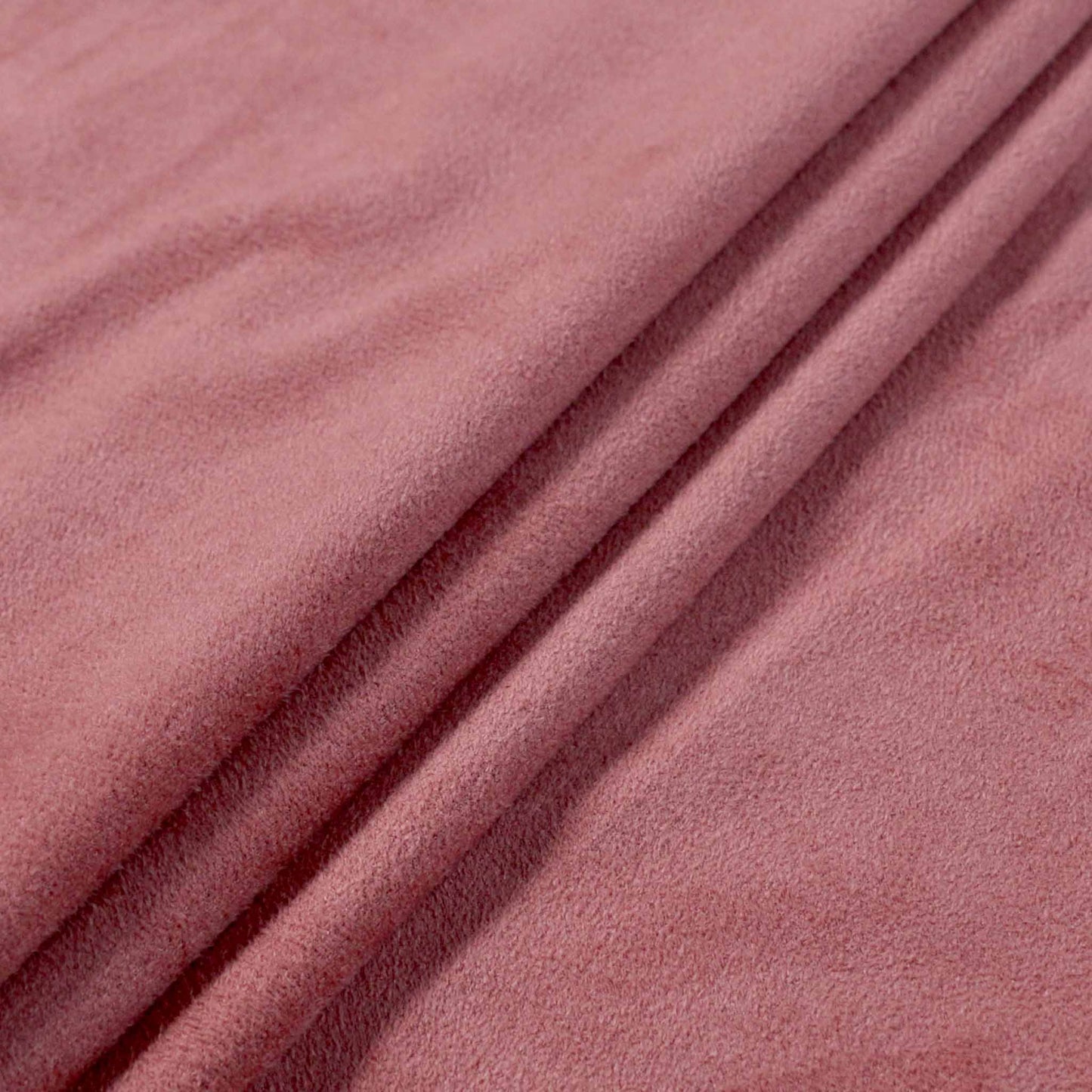 pink suedette stretchy dressmaking fabric with scalloped edge