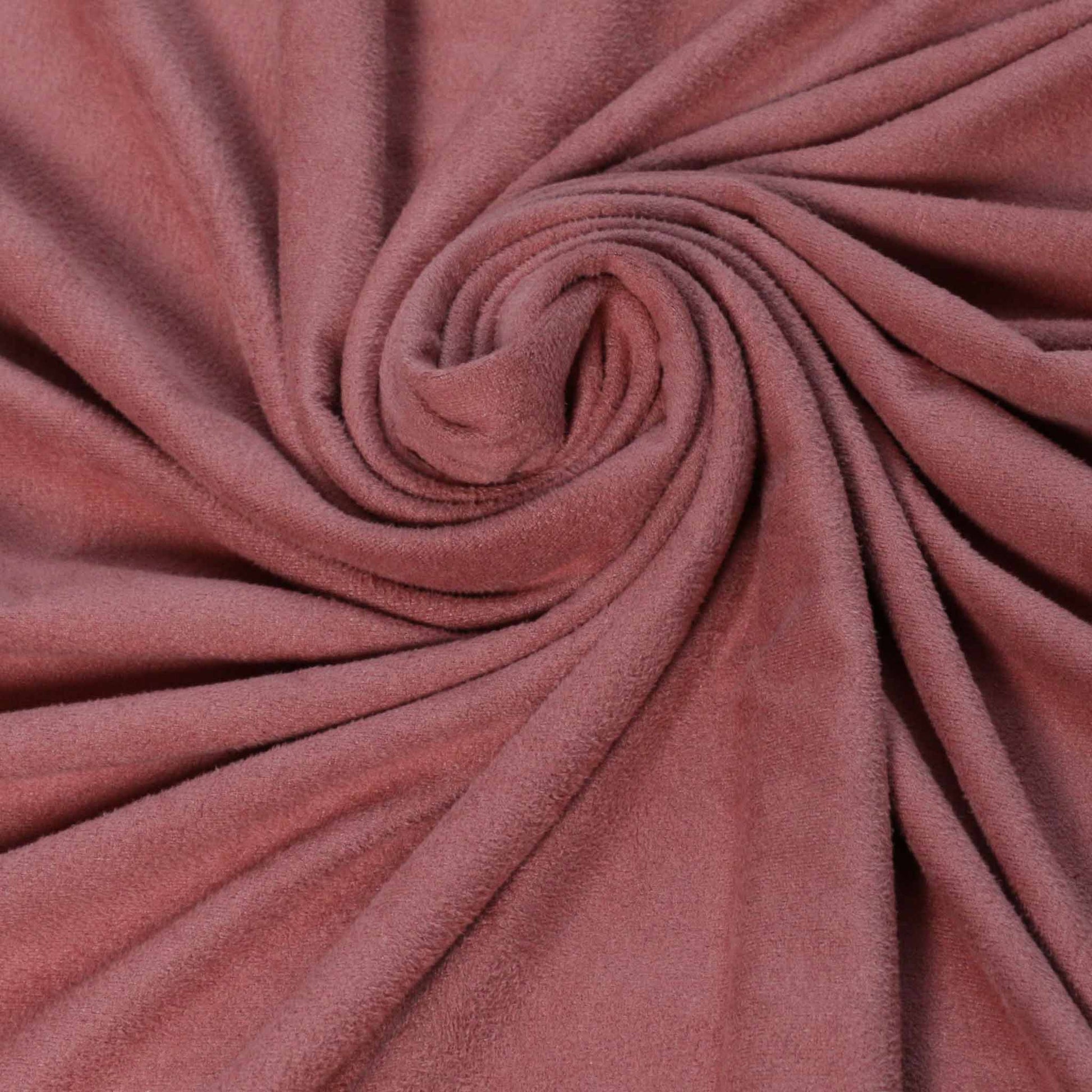pink faux suede fabric for dressmaking with scalloped edge