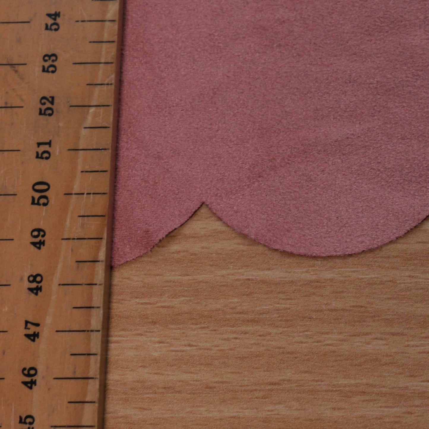 stretchy scalloped edge faux suede dressmaking fabric in pink