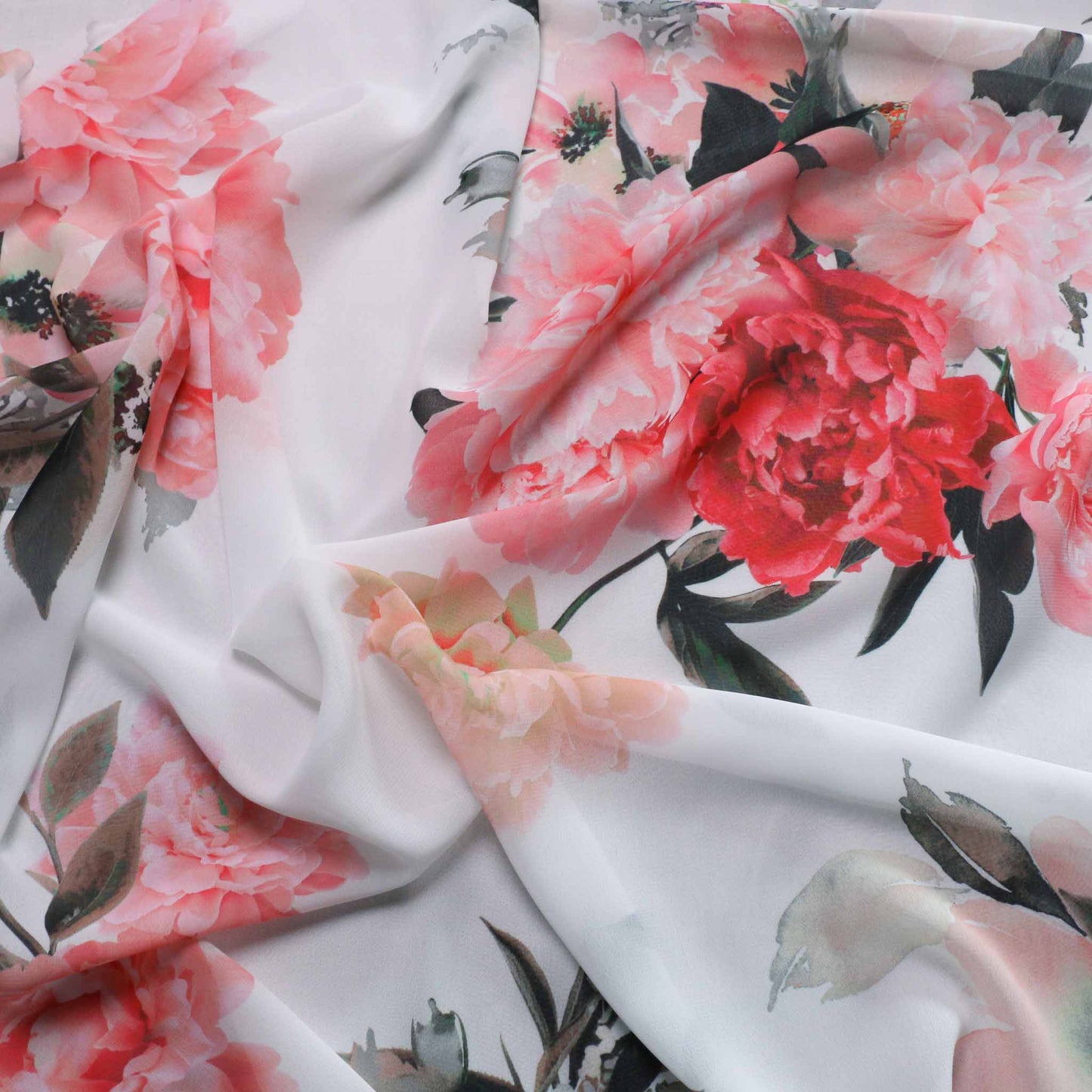 pink and red floral rose print on white chiffon dressmaking fabric