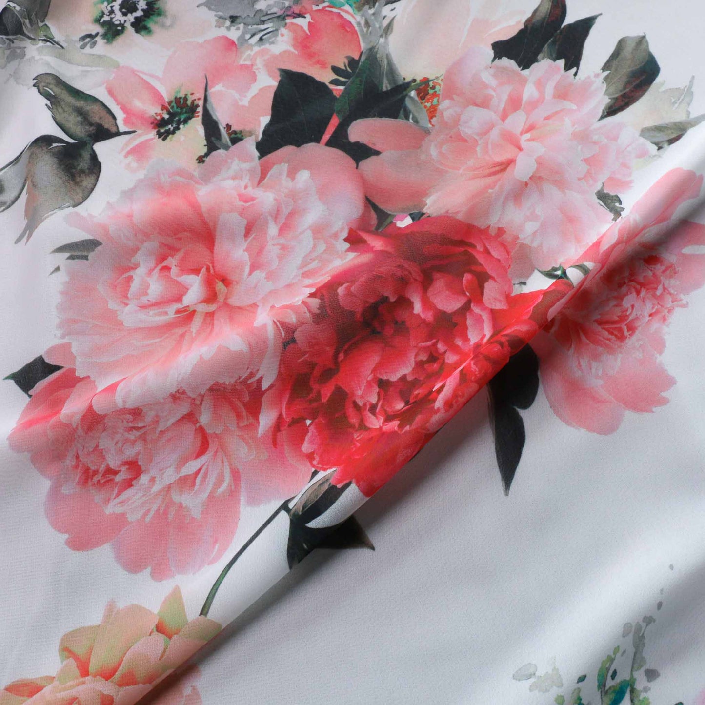 red and pink flowers printed on white chiffon dressmaking fabric