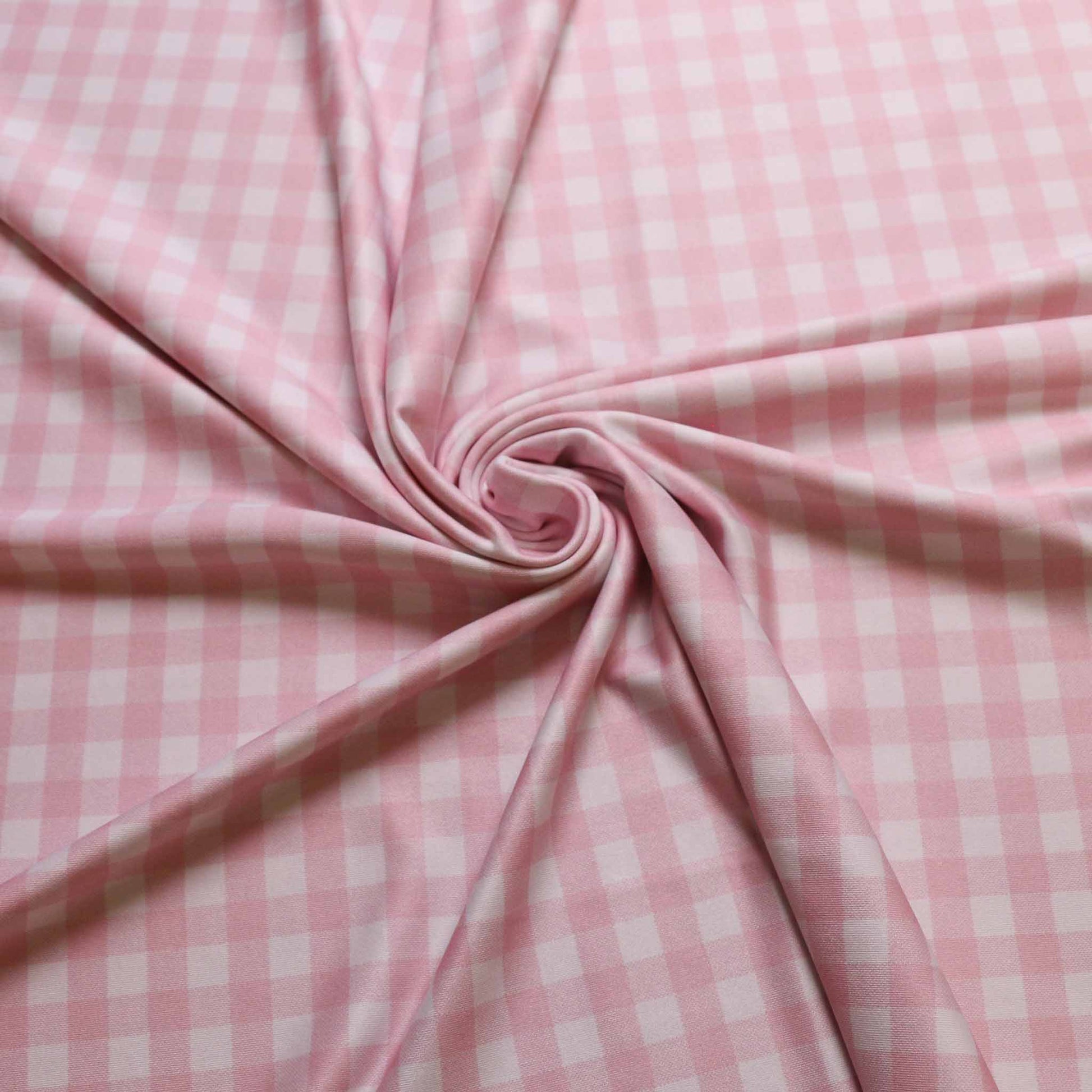 lycra jersey dressmaking fabric with pink and white gingham design
