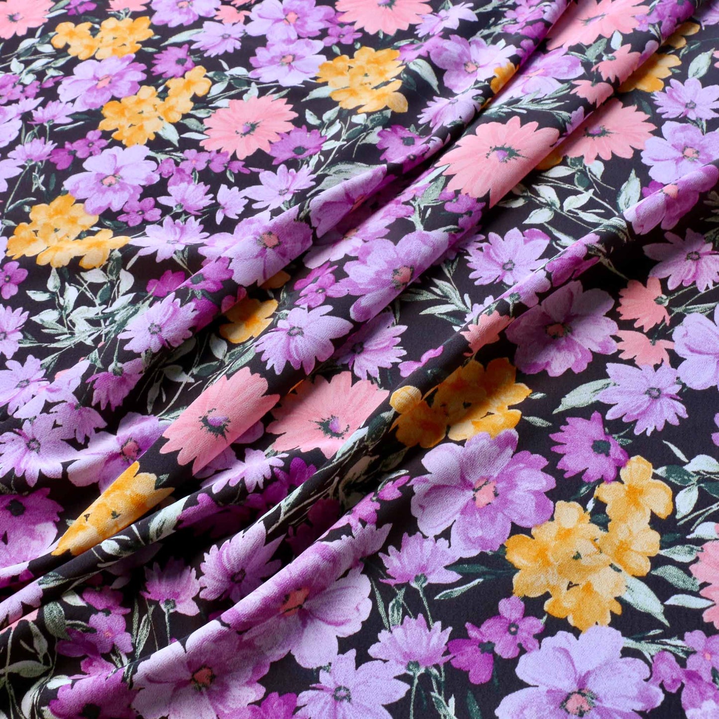 crepe de chine dressmaking fabric with purple and lilac colourful floral print