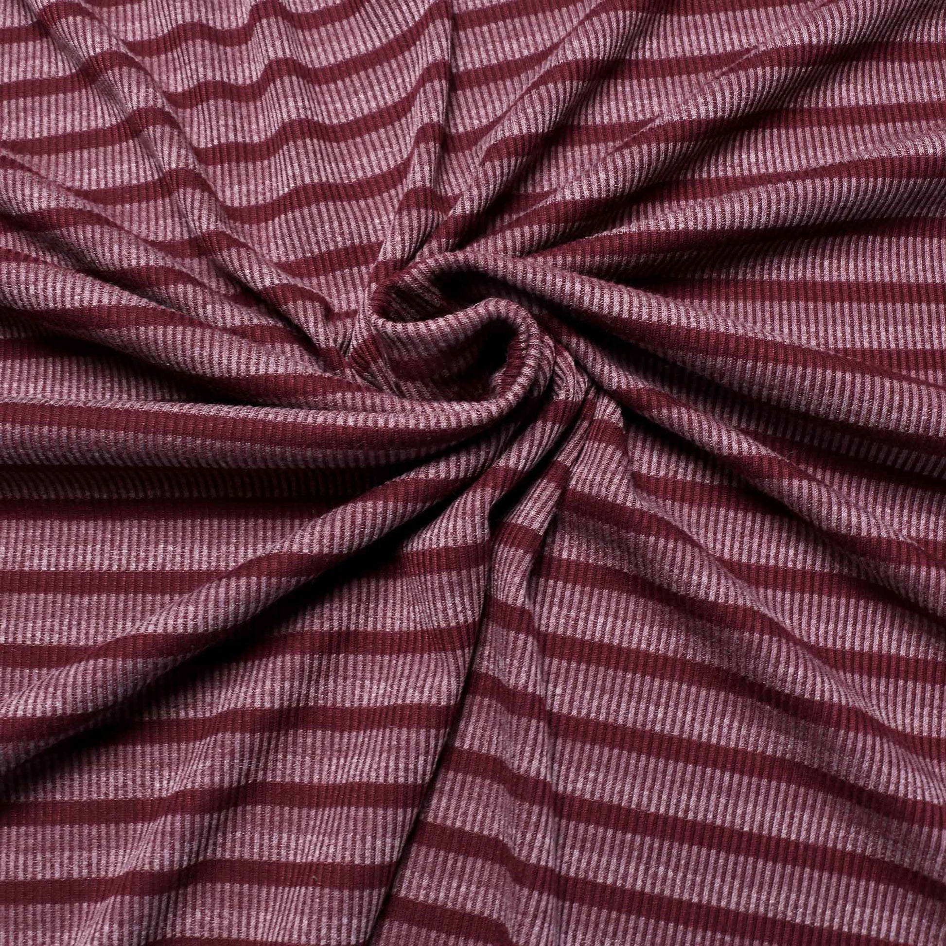 rib striped jersey dressmaking fabric with purple and mauve stripe design