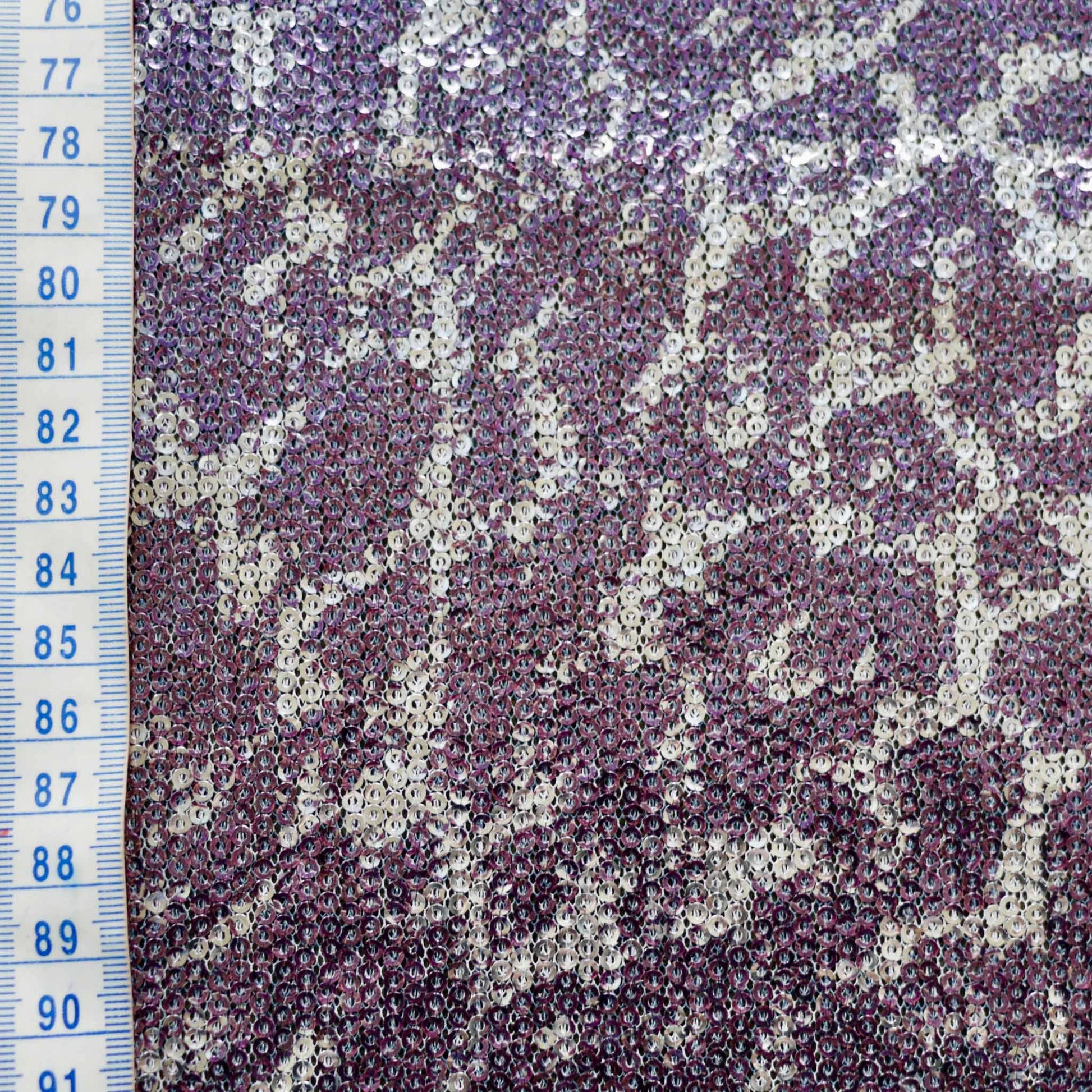 metre sequin mesh dressmaking fabric with animal skin design in silver and purple