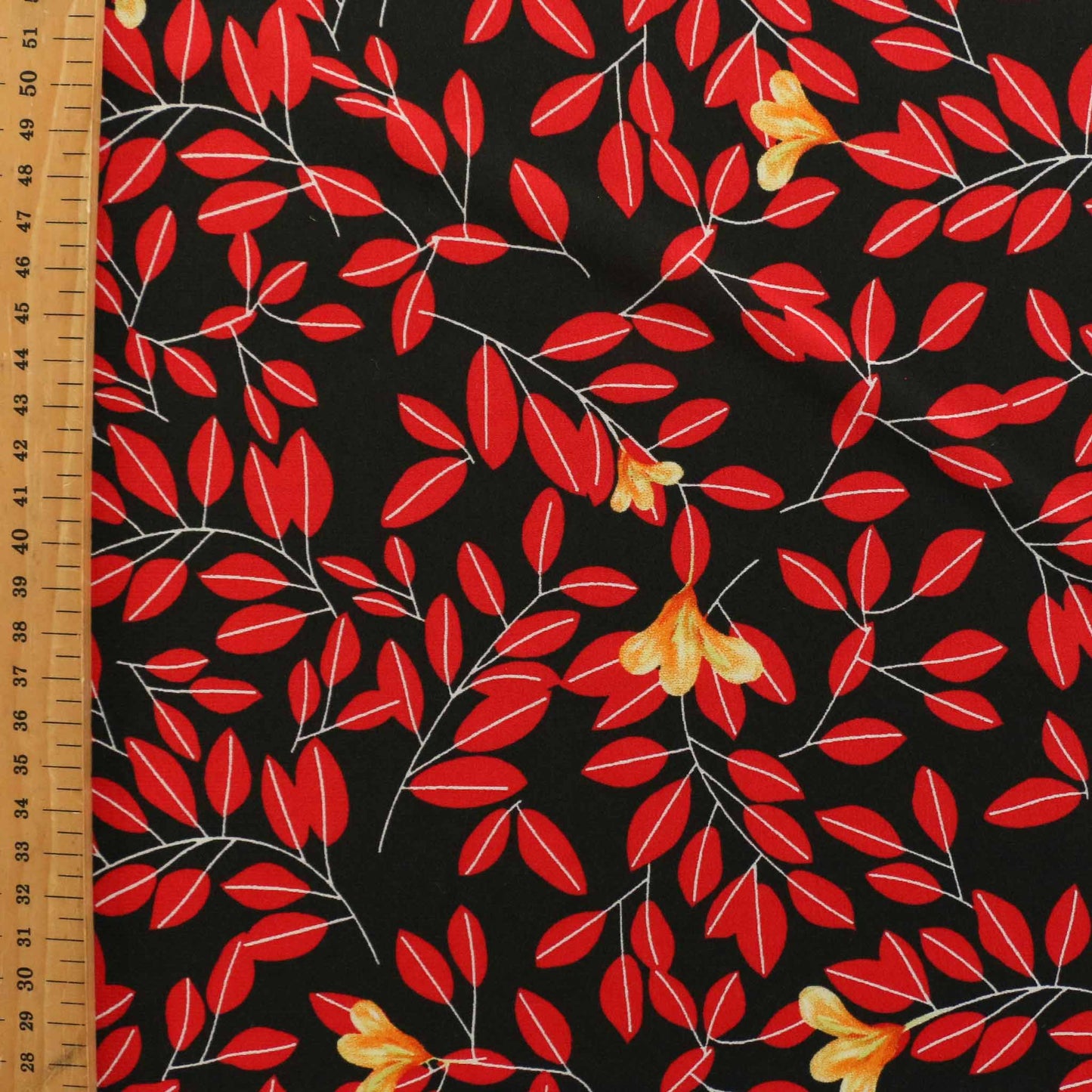 metre black chiffon dressmaking fabric with red leaf design print