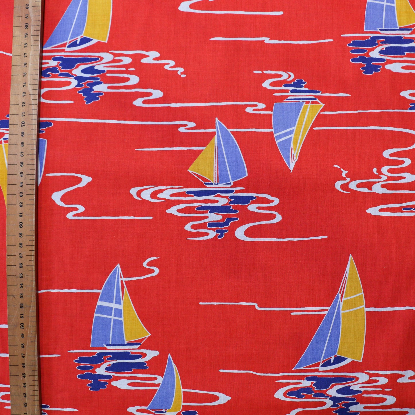 metre vintage sustainable cotton dressmaking fabric with retro nautical boat pattern