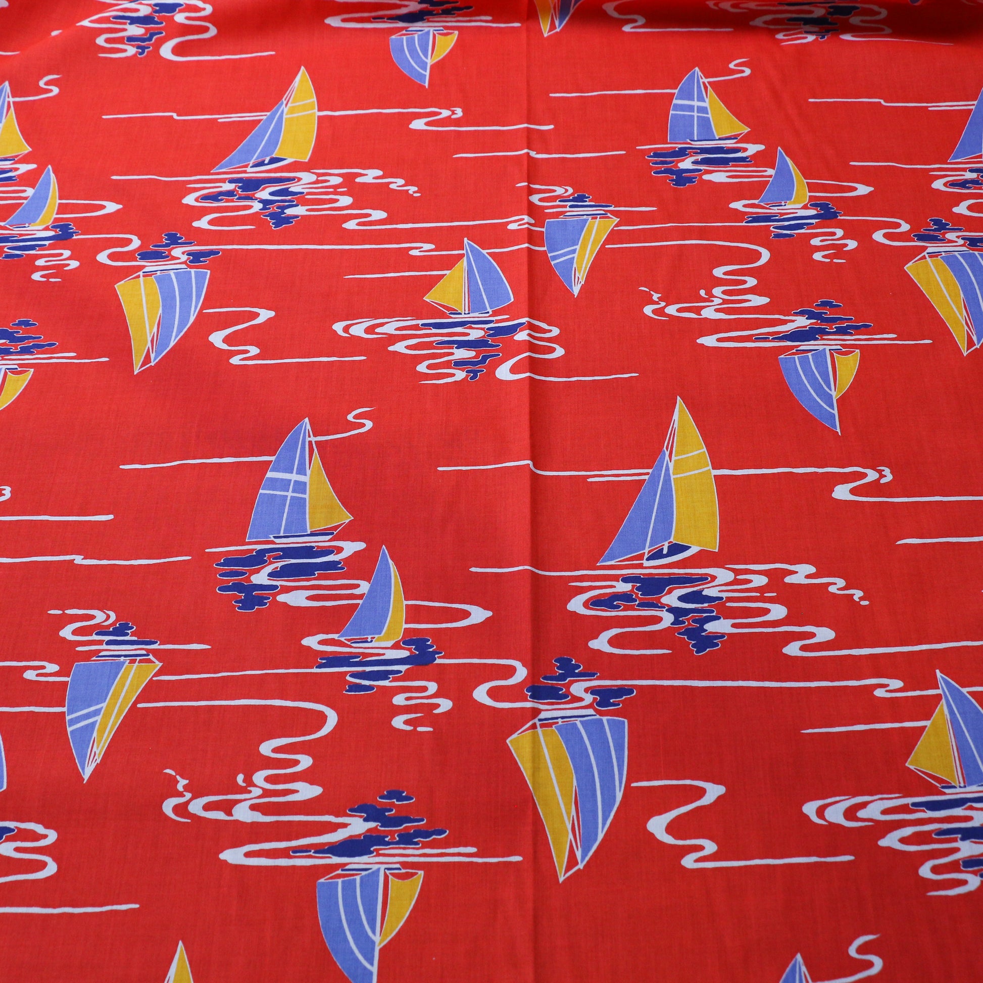 red sustainable vintage cotton dressmaking poplin fabric with nautical boat print