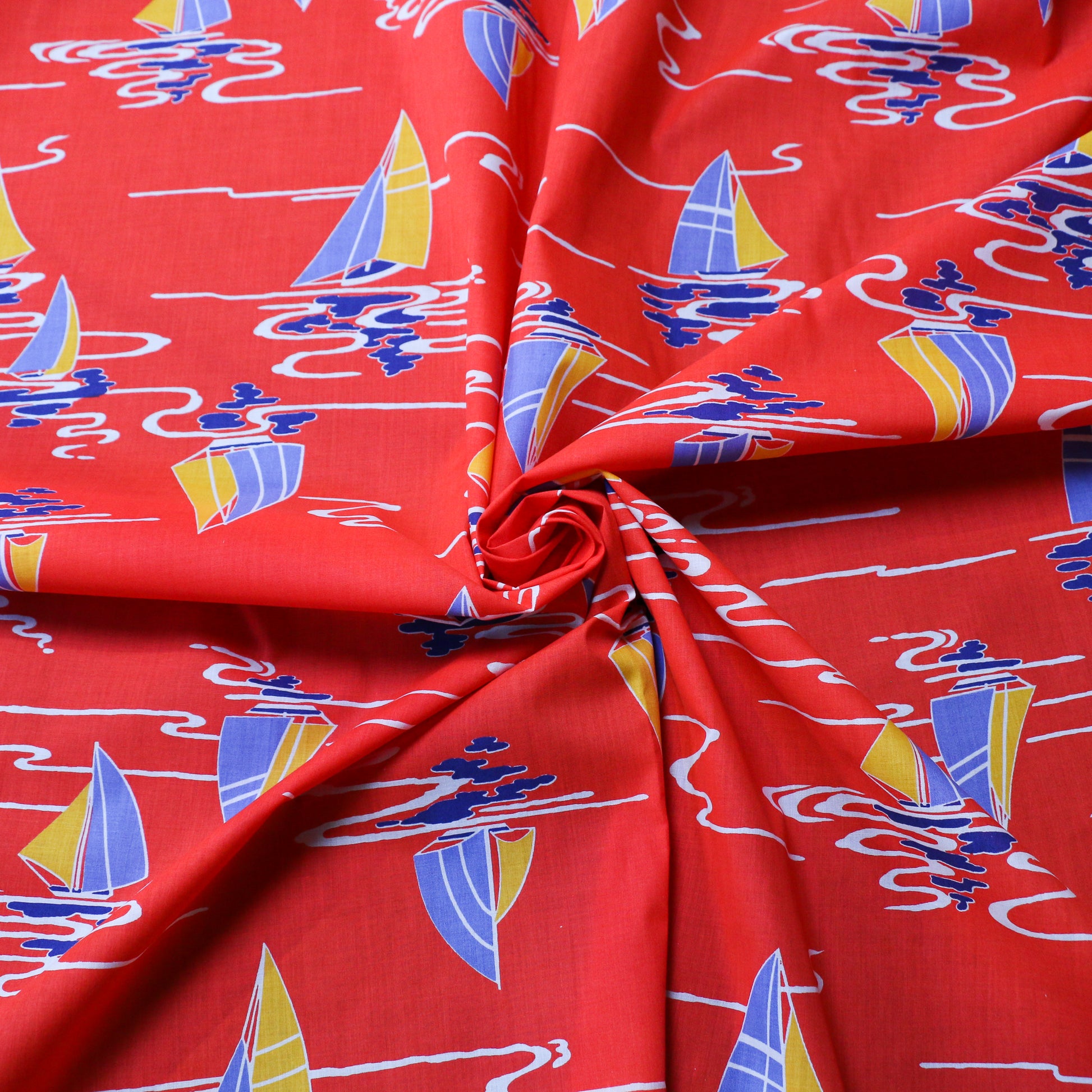 vintage cotton dressmaking fabric in red with blue and yellow nautical boat print