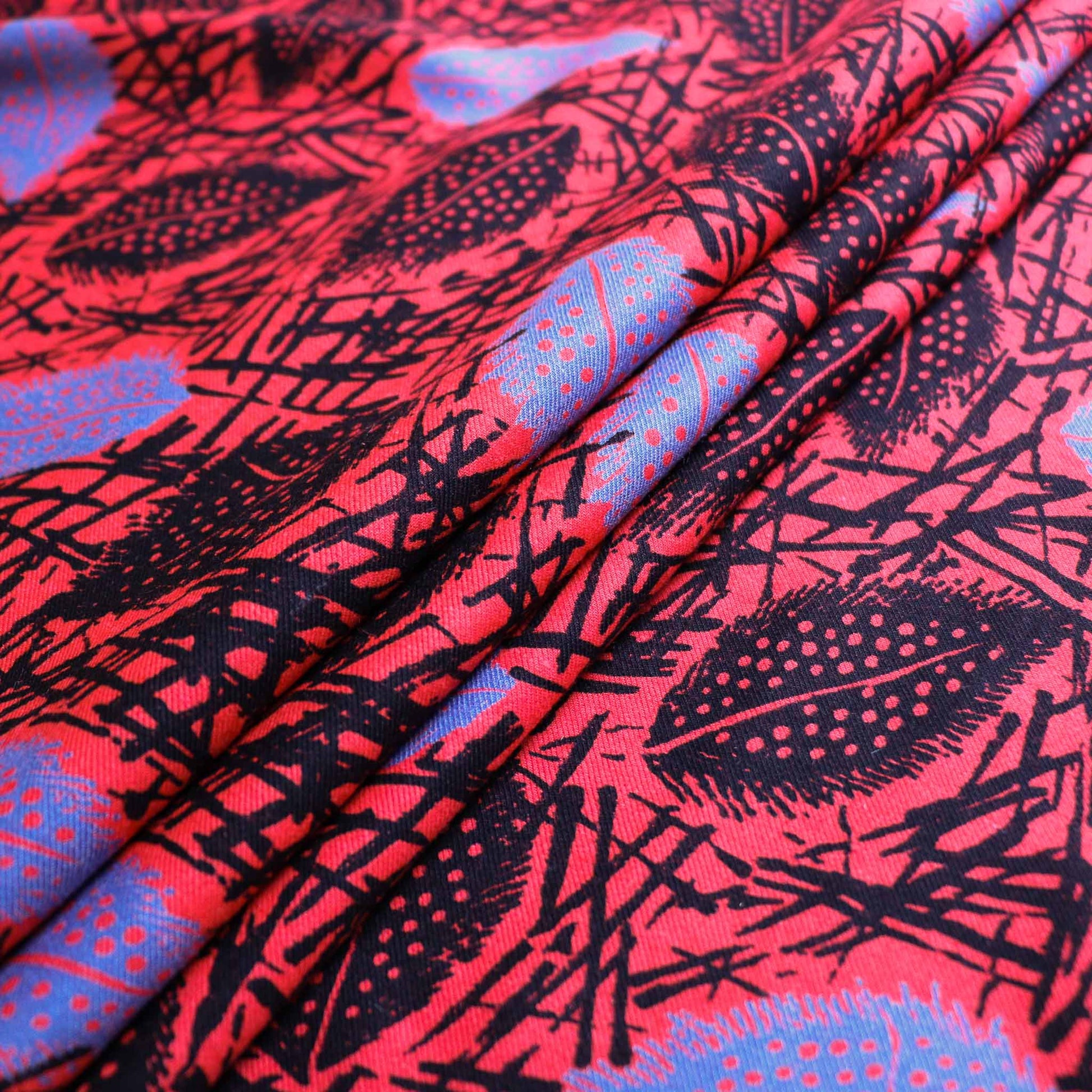 sustainable eco red vintage cotton twill dress fabric with blue and black leaves printed