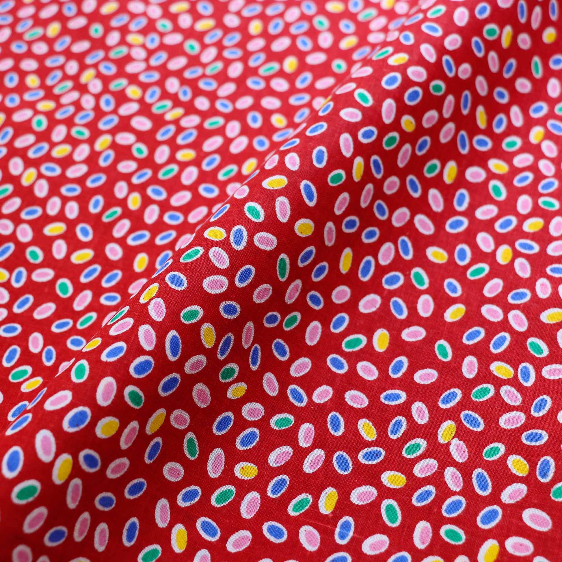 vintage cotton dressmaking fabric in red with multicoloured ditsy dot print