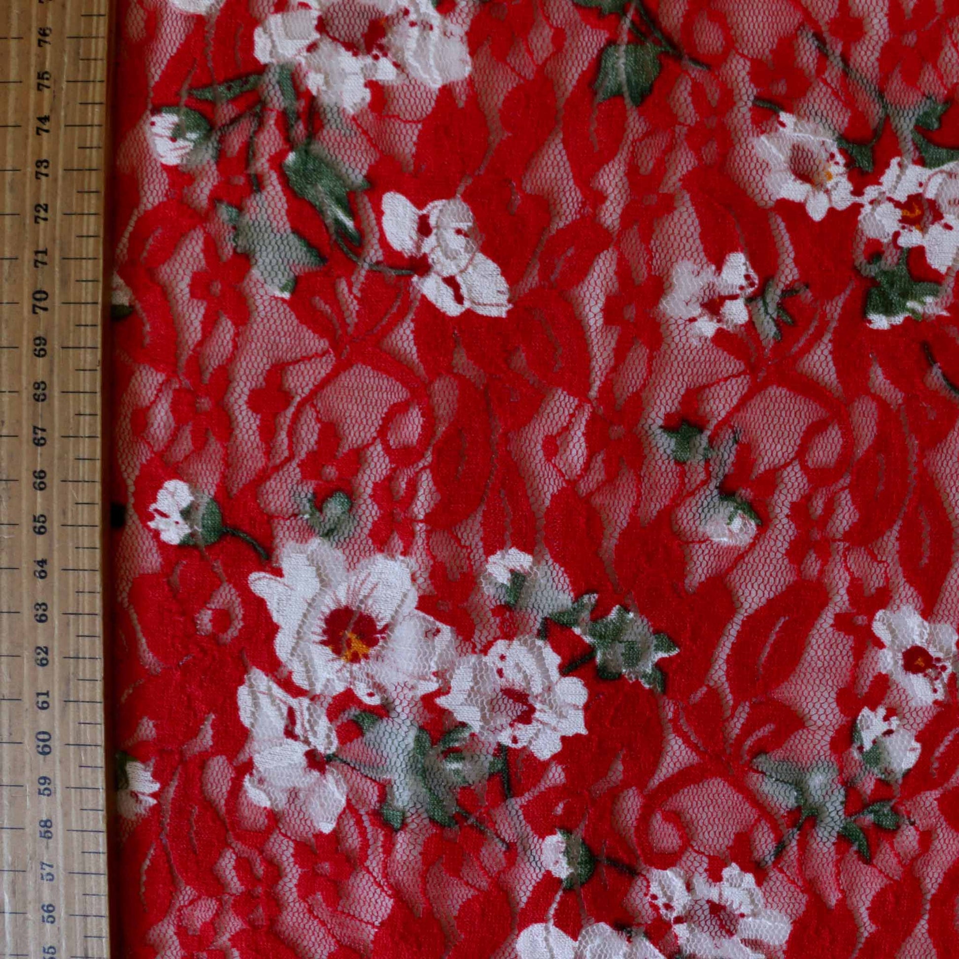 metre red stretchy floral lace dressmaking fabric with white flowers design